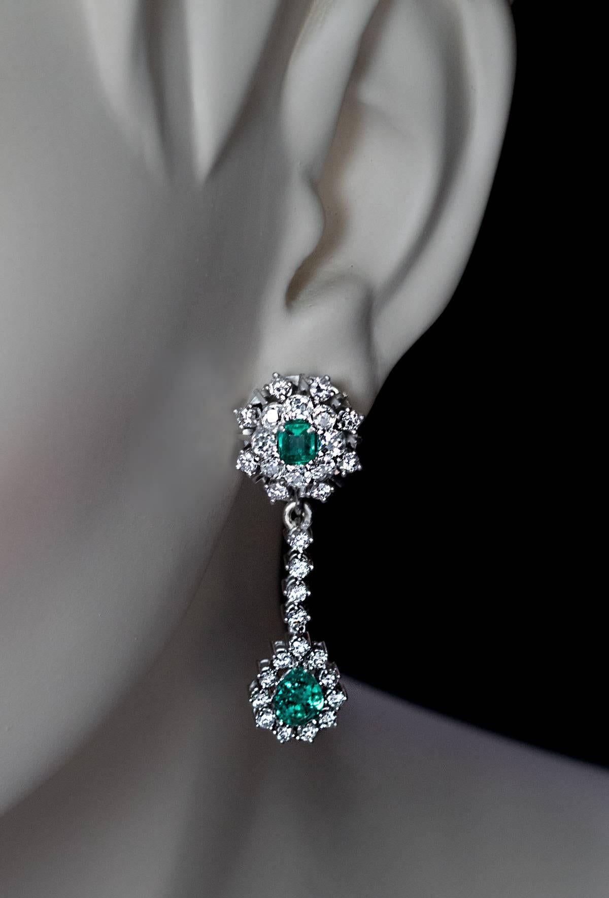 By Austrian maker Anton Heldwein, Vienna, circa 1950s
The earrings are crafted in white 14K gold. The cluster top is designed as stylized snowflake centered with an emerald cut emerald encircled by a row of sparkling old mine cut diamonds and a row