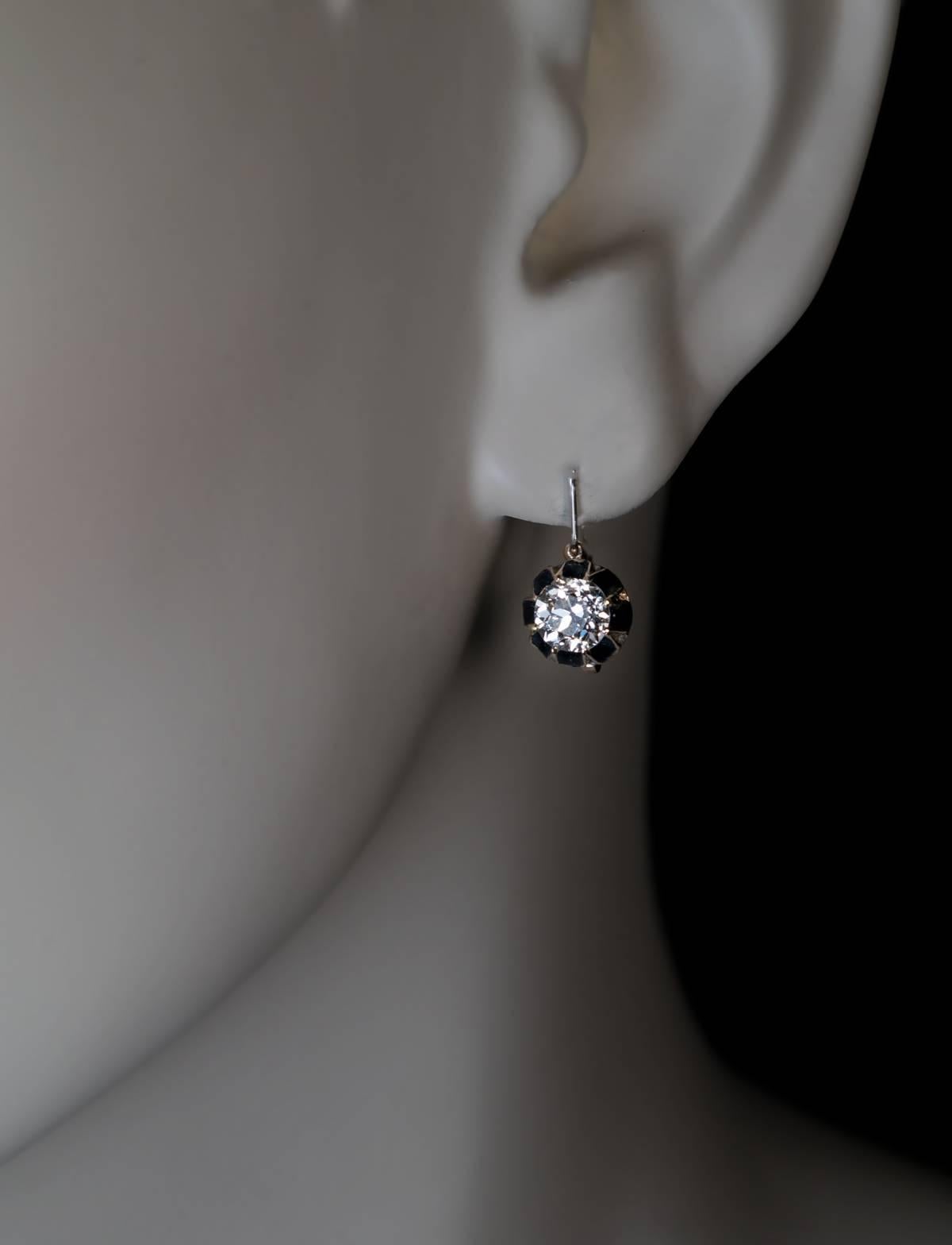 Russian, made in the 1890s.
14K gold earrings are prong-set with two excellent old European cut diamonds: 0.59 ct and 0.62 ct,  accented by opaque black enamel. The diamonds are bright white (F color, VS1 clarity) and very sparkly.

Total diamond