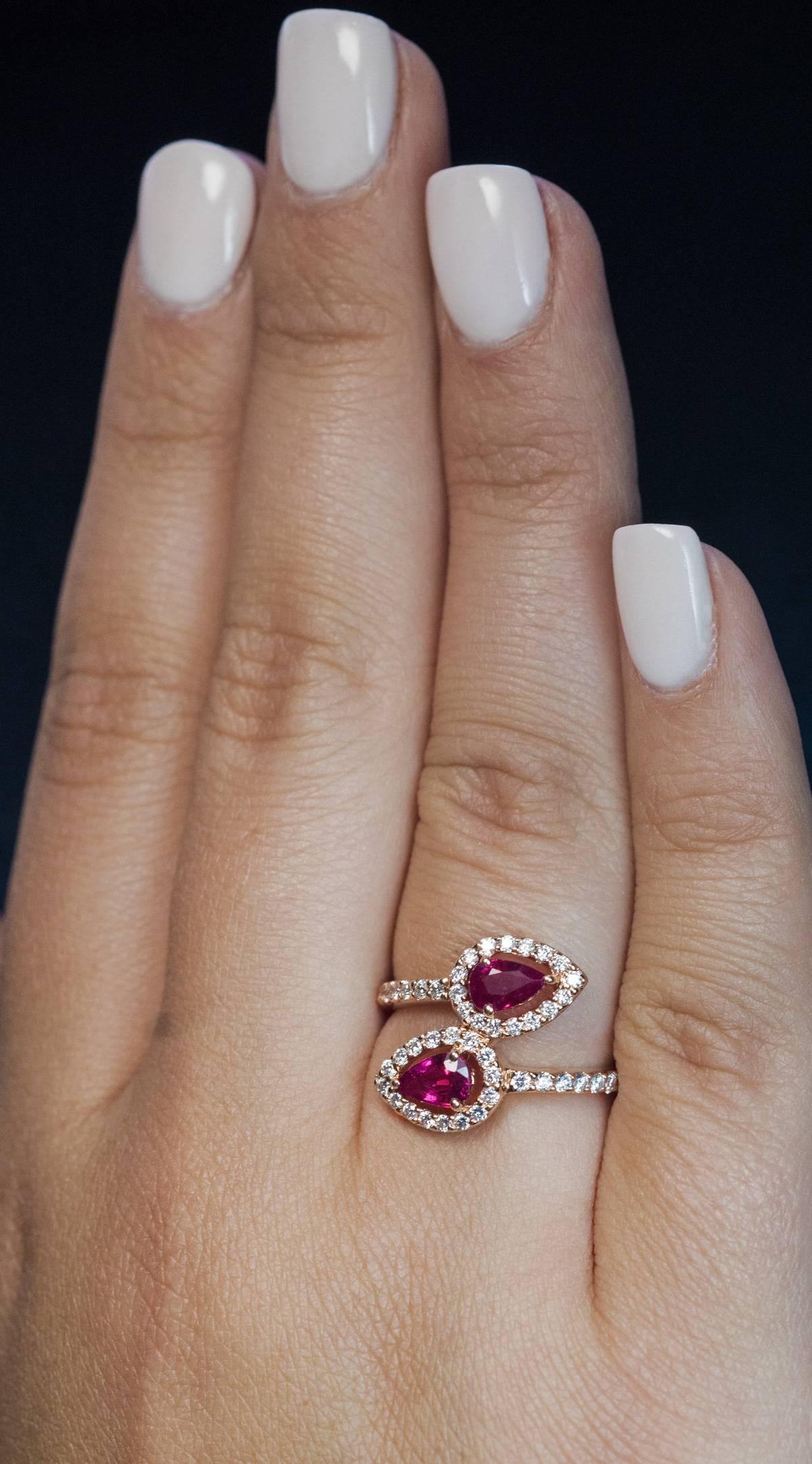 A modern 14K Russian rose gold bypass ring is set with two pear cut natural rubies and 46 sparkling bright white brilliant cut diamonds.
Total ruby weight is 1.18 ct
Total diamond weight is 0.53 ct
Ruby and diamond weight is struck inside the
