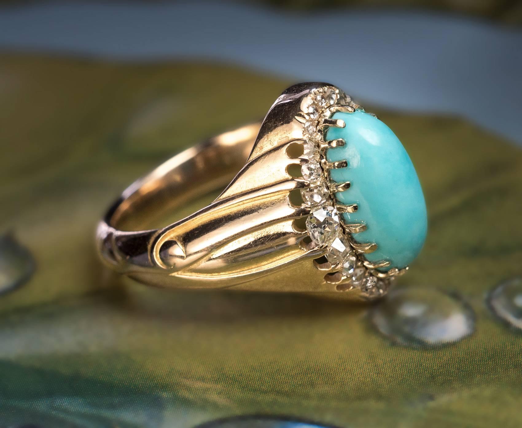 Made in St. Petersburg between 1882 and 1899
A heavy antique 14K gold ring is centered with an oval cabochon cut turquoise (approximately 3 cts) of an excellent color surrounded by old mine cut and old rose cut diamonds. The shoulders of the ring