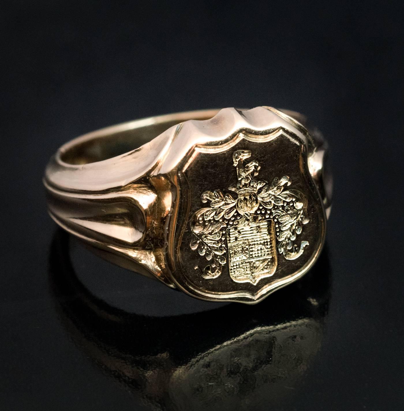 Made in St. Petersburg in the 1870s
This antique Russian 14K gold men’s armorial seal ring features a finely carved noble coat of arms. The highly unusual element of the armorial is a profile figure of a hunting dog placed over the crown of