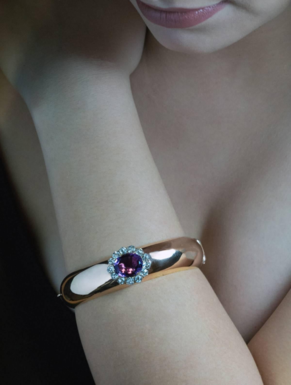 Made in Odessa between 1908 and 1917

This chunky highly polished rose gold bangle bracelet is centered with a plum purple amethyst (approximately 8.60 ct) surrounded by faceted aquamarines.

The bracelet is marked on clasp with 56 zolotnik Imperial