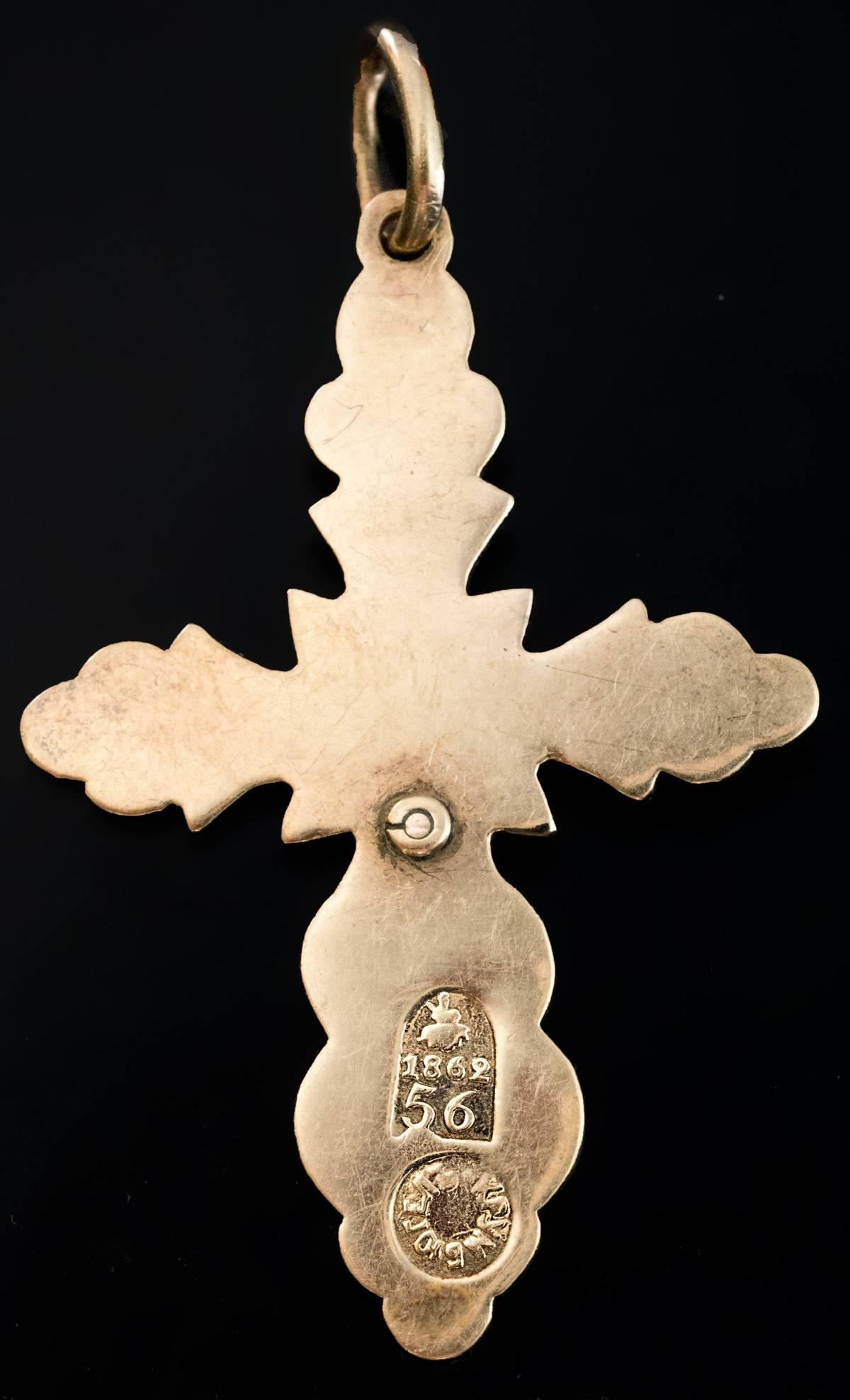 dated 1862

An ornate Russian 14K gold cross pendant with an engine turned wavy pattern.
The cross is stamped on the back with Moscow assay mark for 56 zolotnik gold and maker's mark.

Length without suspension ring  43 mm (1 6/8 in.)
