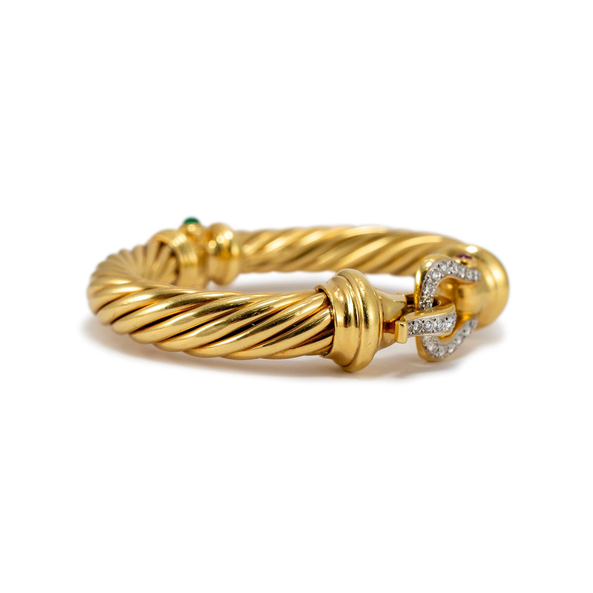 Brand: David Yurman

Gender: Ladies 

Metal Type: 18K Yellow Gold

Length: 6.00 inches

Width: 10.00 mm

Weight: 57.60 grams

Ladies18K yellow gold diamond emerald and ruby clip-on cuff bracelet. The metal was tested and determined to be 18K yellow