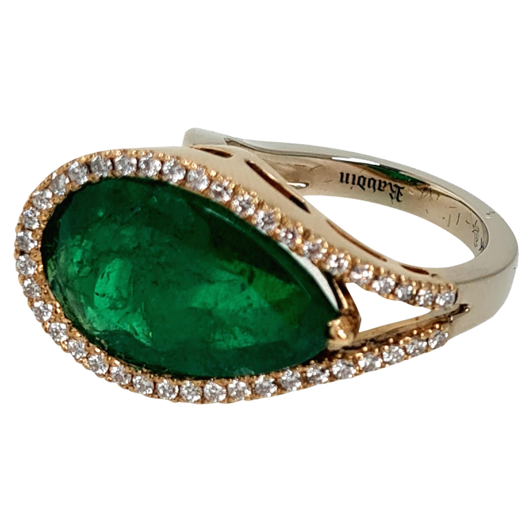 The center stone is a GIA certified 8.71 ct Columbian Pear Cut. This stone is extremely rare, and i have never seen a Columbian Emerald in this size and richness in color. This stone is accompanied with a designer ring by RAVDIN; a Florida-based