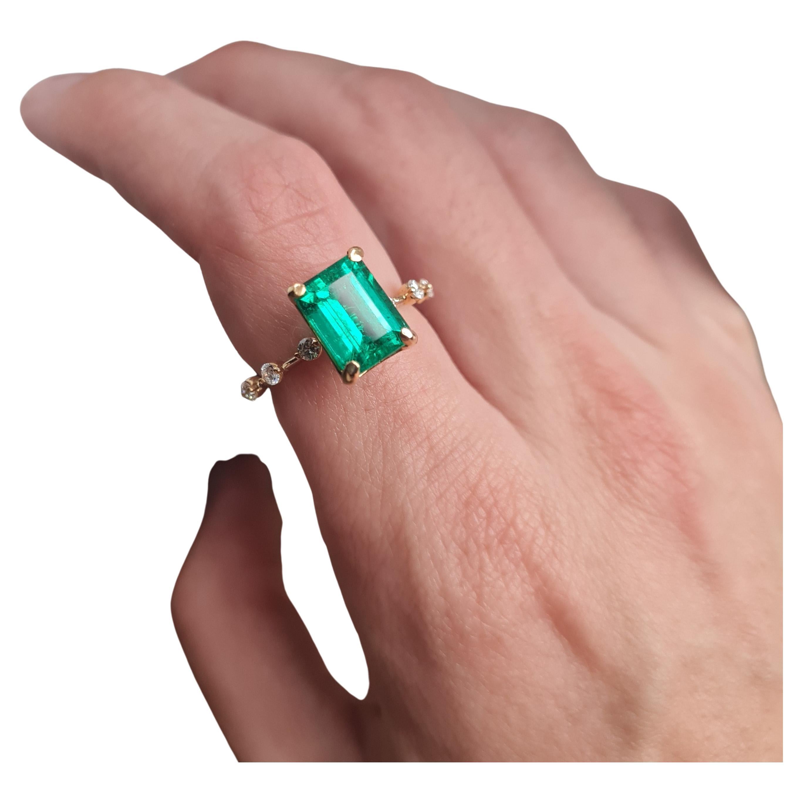 This is the first Columbian Emerald-Cut, Emerald made by Jacob Ravdin. This stone is unlike any other, a true rarity. This stone comes with a GIA certificate, which not only states its authenticity, but origin, too. This ring is crafted out of solid