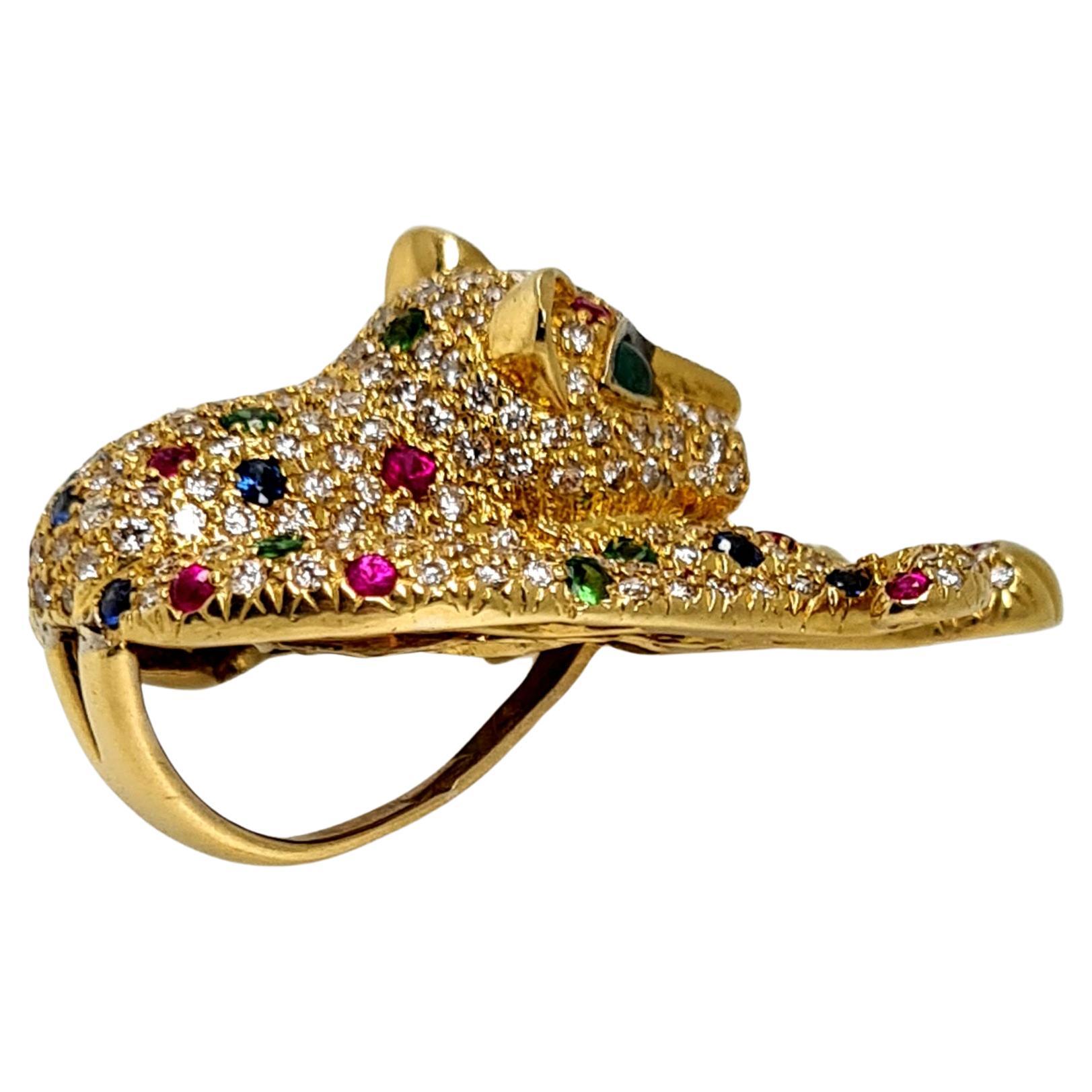 This Pendant is made out of solid 18k gold (20 grams) with 5cts of  natural diamonds, sapphires, rubies, and emeralds. This pendant was made by Ravdin, and the setting work is done pavé style. The eyes of the cougar are cut from natural emeralds,