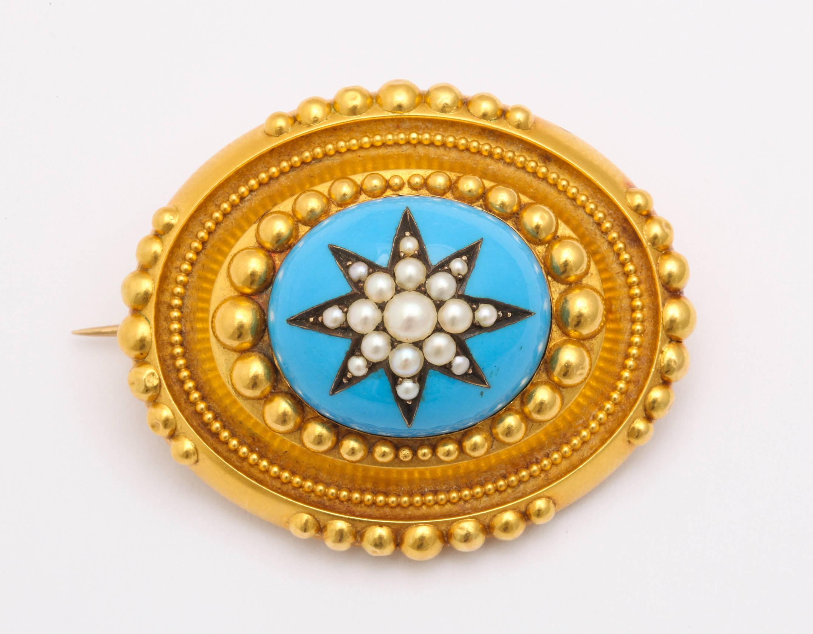 A granulated jewel of a brooch, set in 18kt soft toned gold, showcases a star of gleaming natural pearls on turquoise blue enamel. Layers and texture were created by the jeweler's hand that placed an oval of granulation around the enamel, another of