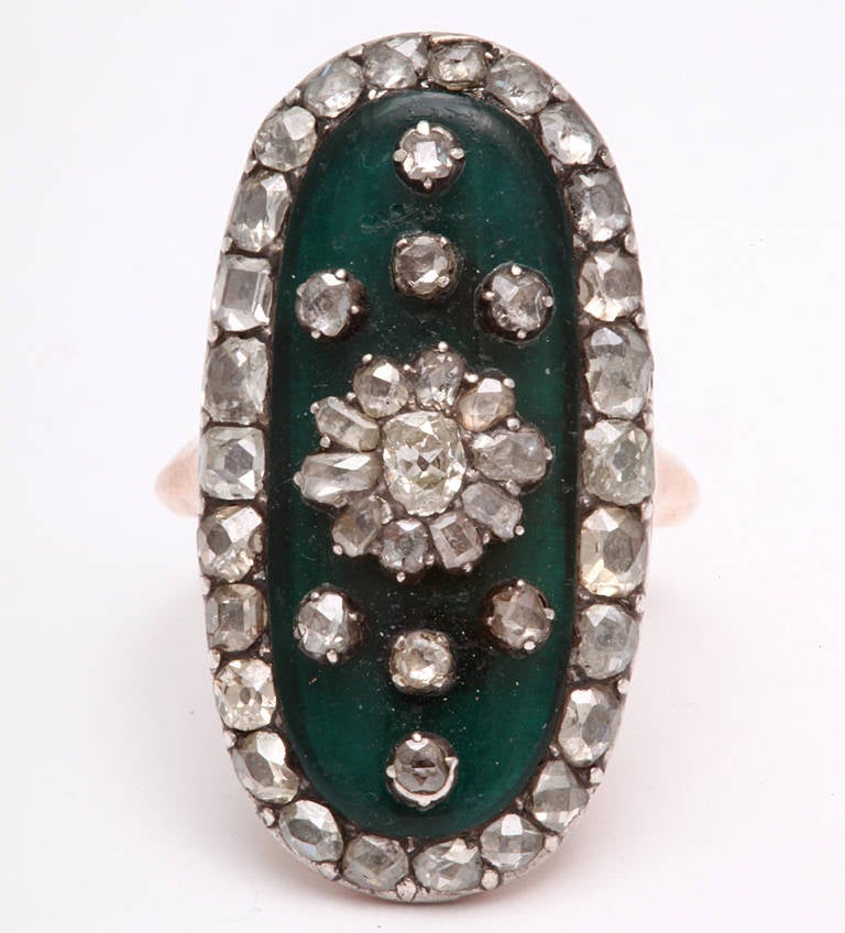 Opulent and Rare Georgian Diamond Ring with Forest Green Background