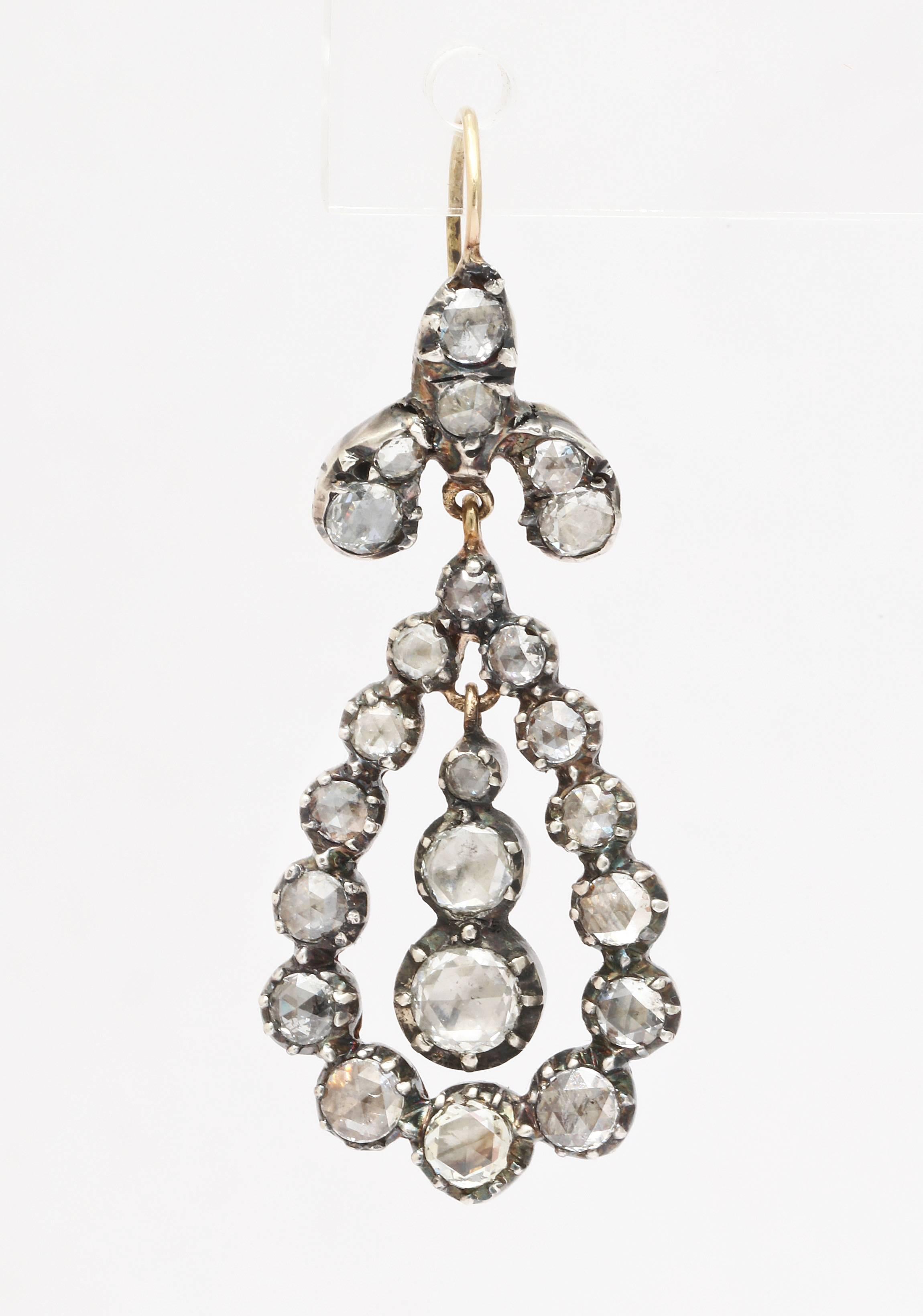 Perfect Georgian Revival Diamond earrings are just the right length to wear day or night, blue genes to evening. The gold is 15kt. The country of origin is the United Kingdom. The diamonds are foiled with their settings closed. This was the manner