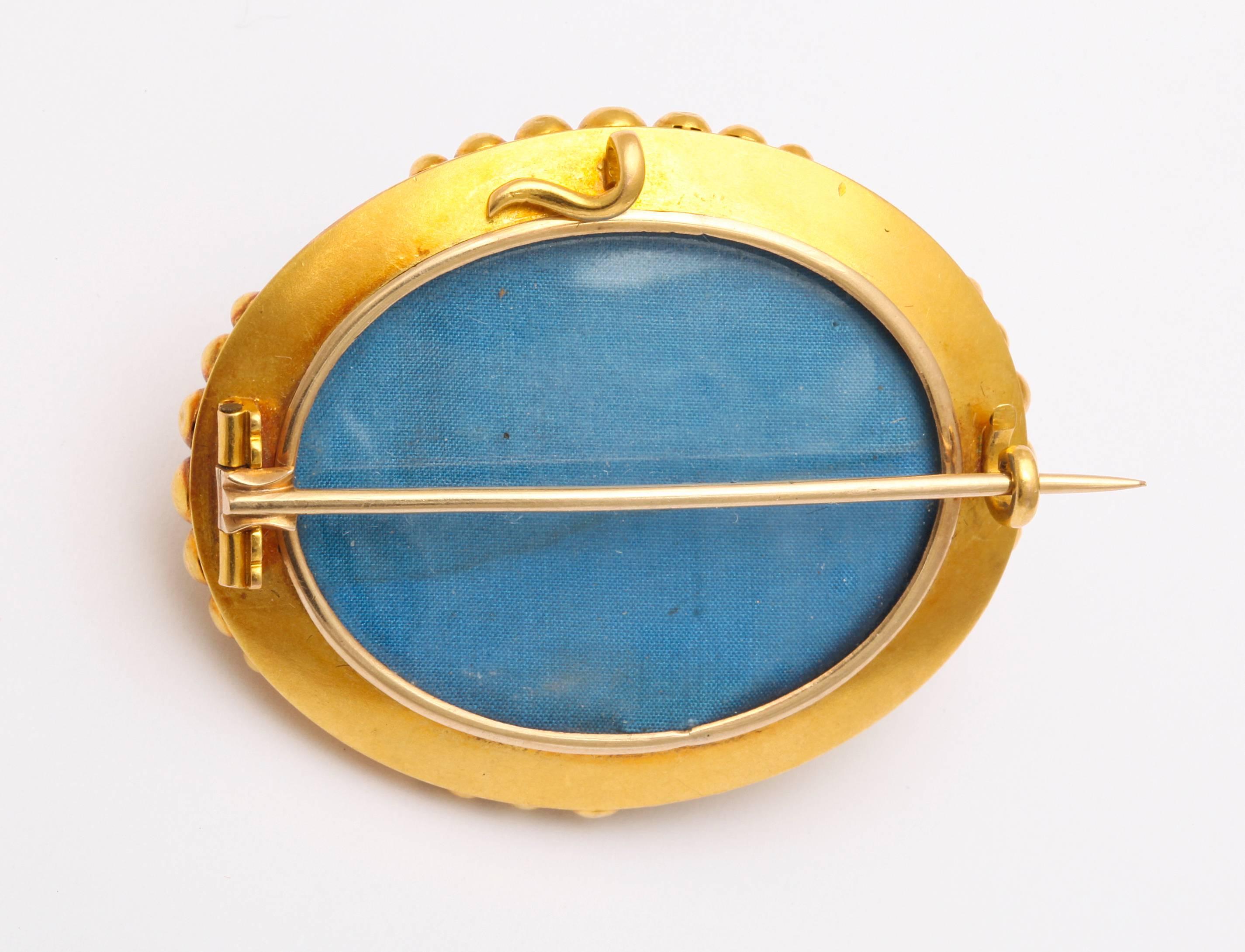turquoise and gold brooch