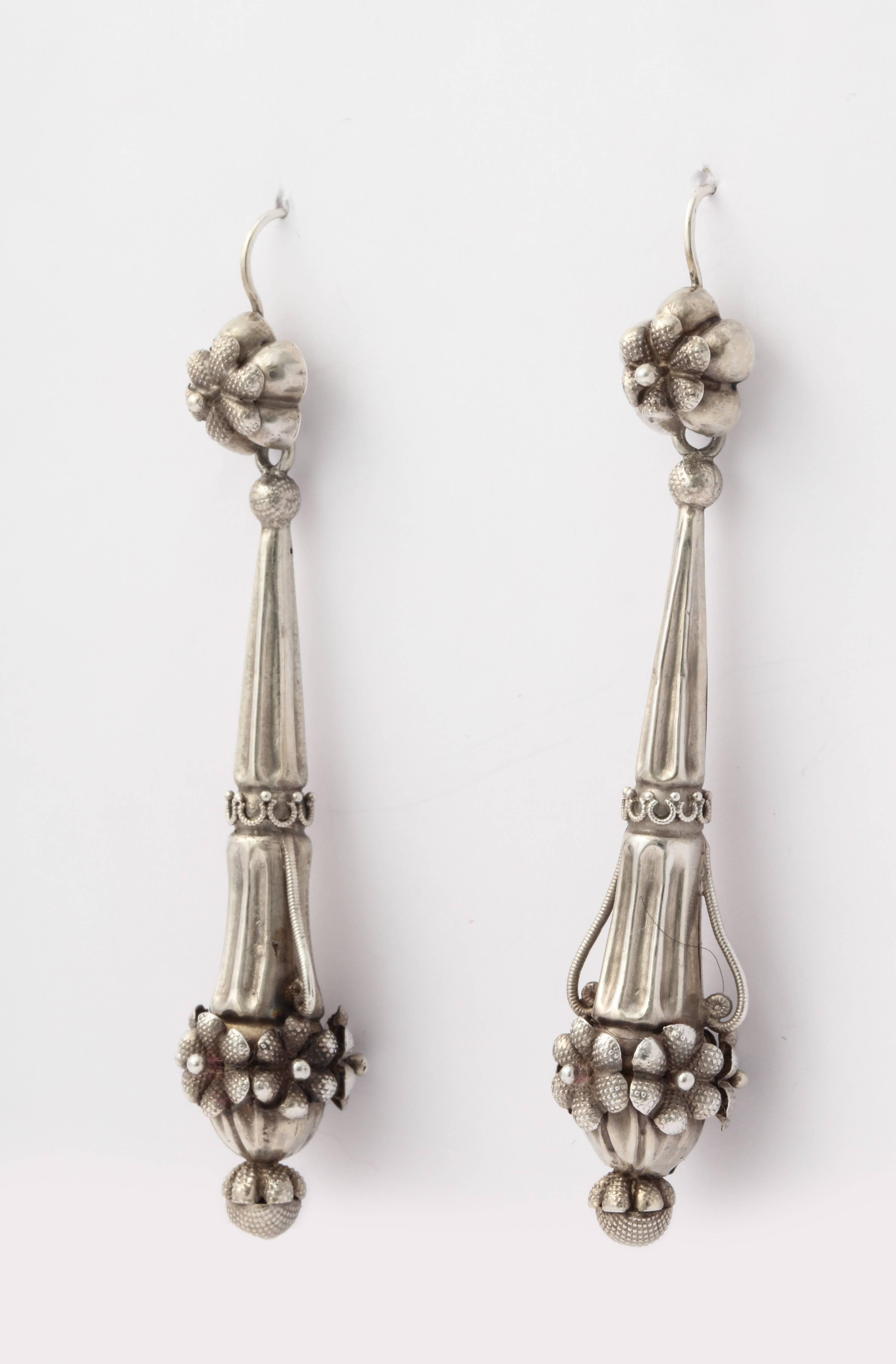 Very rarely do Georgian silver chandelier earrings come on the market. I can't say why, but truth be told, they are far more scarce than are gold. I had only one other pair in 30 years. This pair is a treat. The form is an inverted flute with