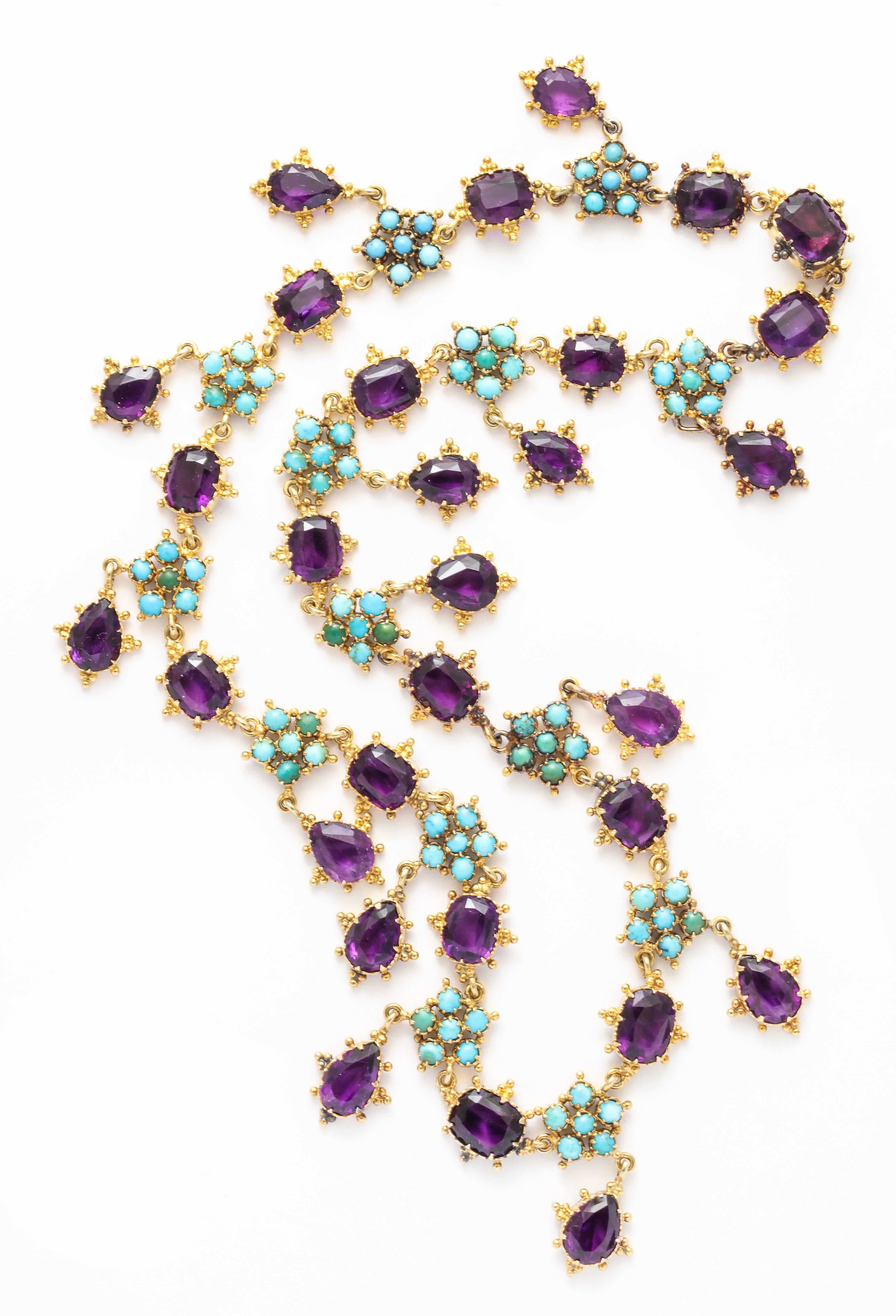 Lush granulation surrounds every amethyst and turquoise flower as the links join pear shaped and rounded corner amethysts with natural turquoise. This rare beauty was made c. 1855 when Queen Victoria was young and
the aristocracy were the only