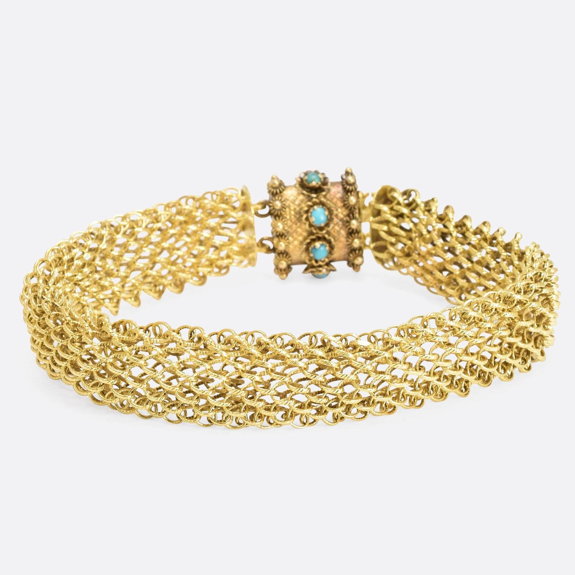 A comfortable, completely engraved bracelet of woven 15 kt gold, is secured by an ornamental, engraved barrel clasp set with natural turquoise. The bracelet  matches necklaces seen worn by royalty and aristocrats in the Georgian era portraits at the