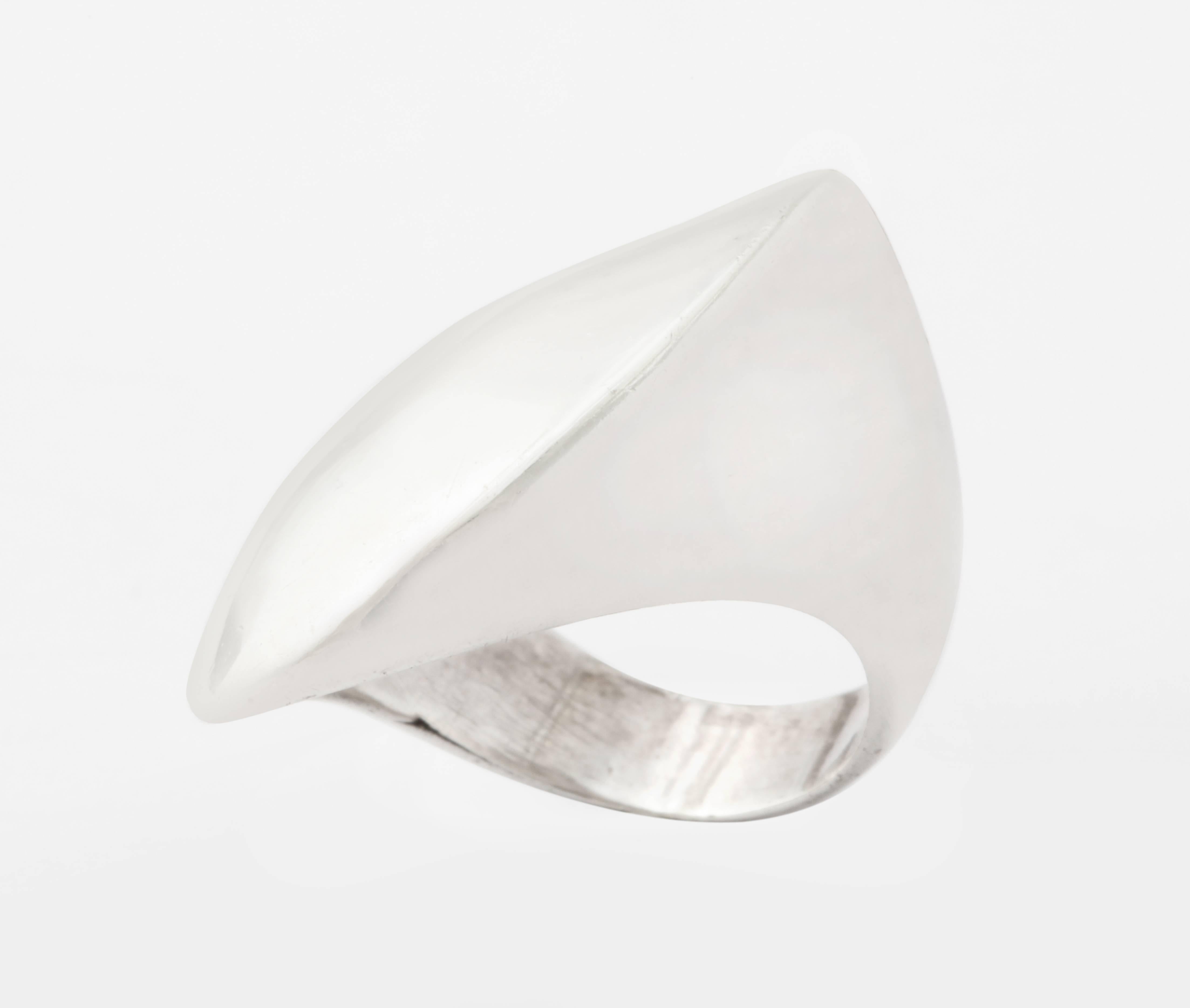 A sweeping modernist ring, hallmarked and designed by Nanna Ditzel from the Danish silversmithing shop of Georg Jensen in Denmark c. 1940-50. The ring in solid sterling is like a sculpture. Nanna Ditzel was a multi talented artist. She studied in