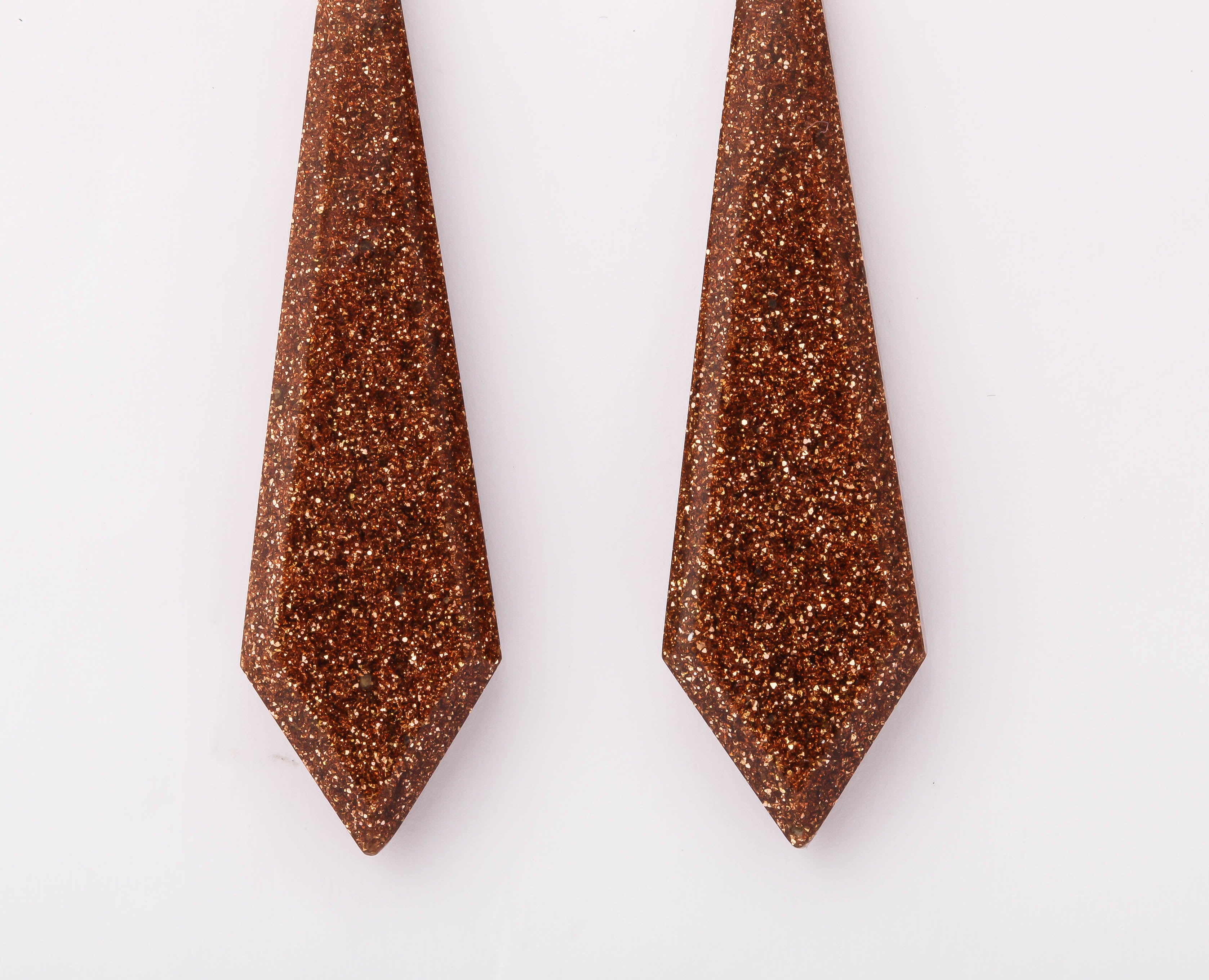 Enlarge the photograph please and imagine the Intense golden micro spots that radiate within these chandelier goldstone earrings from c. 1870. Imagine the brightest sun on water. The gold sparkle is highly concentrated on the background copper color