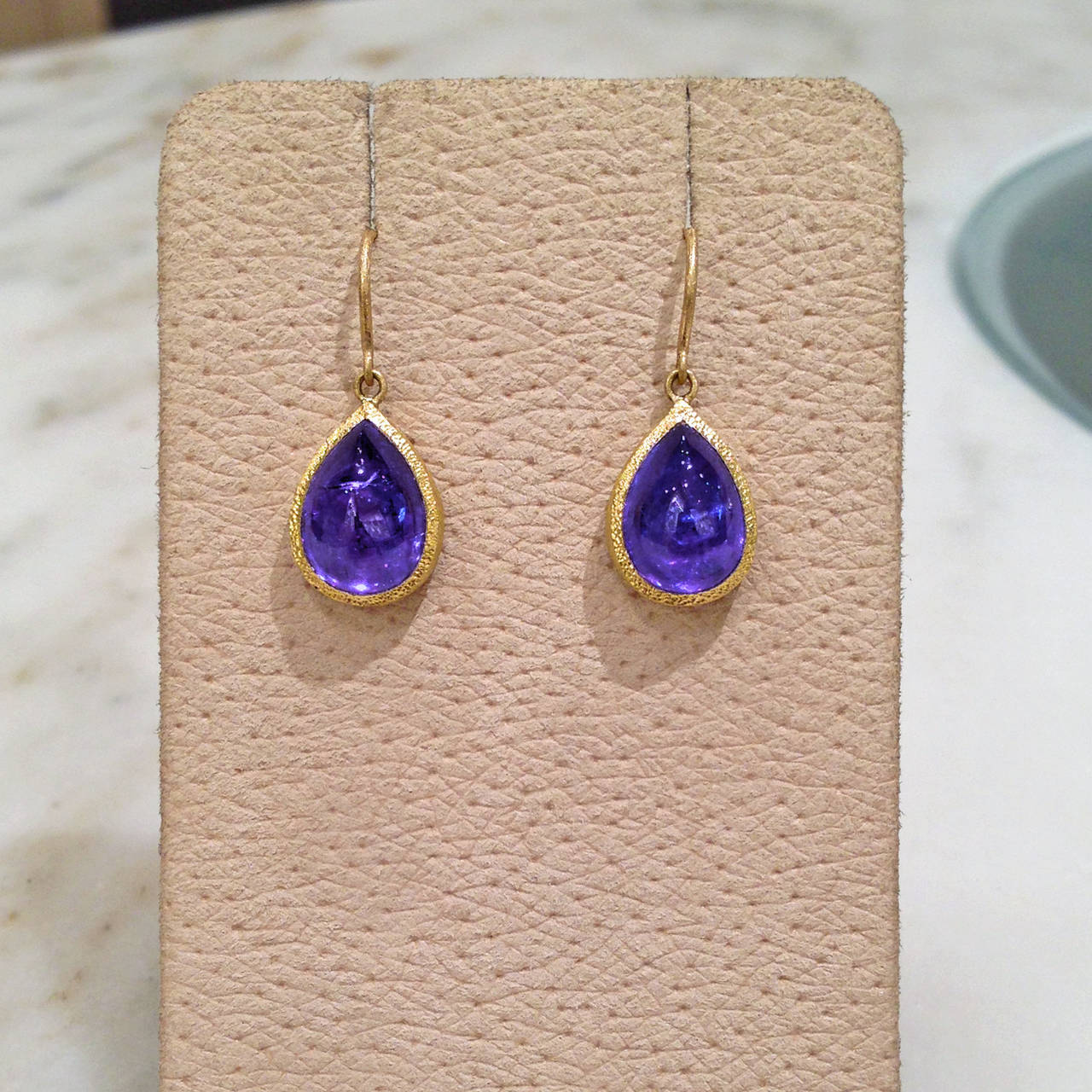 One-of-a-Kind Earrings handcrafted in 22k yellow gold with violetish-blue pear-shaped tanzanite cabochons. Incredible color.