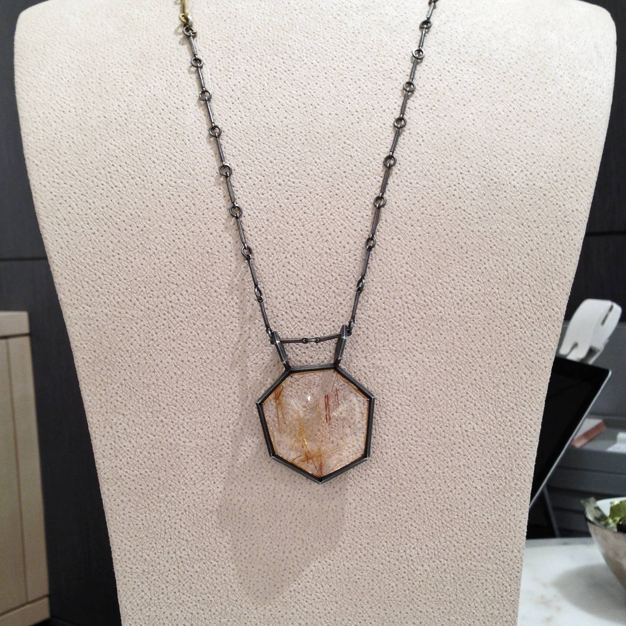 One-of-a-Kind Necklace with a beautiful rutilated quartz pendant handcrafted in graphite-finished sterling silver and matte 18k yellow gold. The rutilated quartz is faceted on one side and smooth on the other, and can therefore be worn both ways.