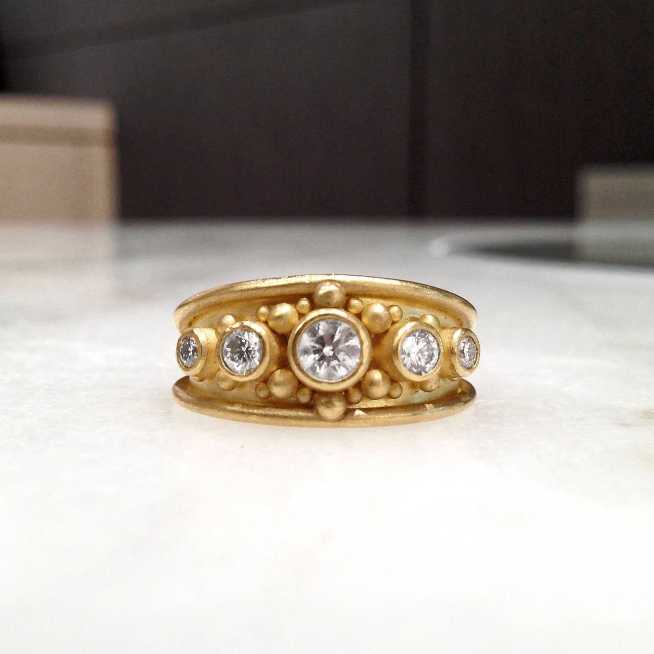 Handcrafted Cigar Band in 22k yellow gold with round, brilliant-cut white diamonds totaling 0.55 carats. Tiny handmade gold granules are individually fused onto the surface of the metal without solder. This delicate and detailed process has been