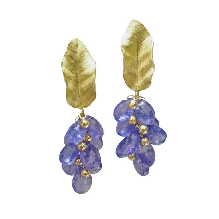 Cluster Earrings handcrafted in matte-finished 18k yellow gold with tanzanite briolettes and 18k gold granulation dangling from petal tops with 18k gold post and clip. 