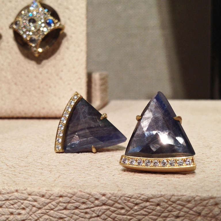 Handcrafted, one-of-a-kind Dagger Earrings in matte 18k yellow gold with blue sapphire slices and eighteen white round brilliant-cut diamond accents.