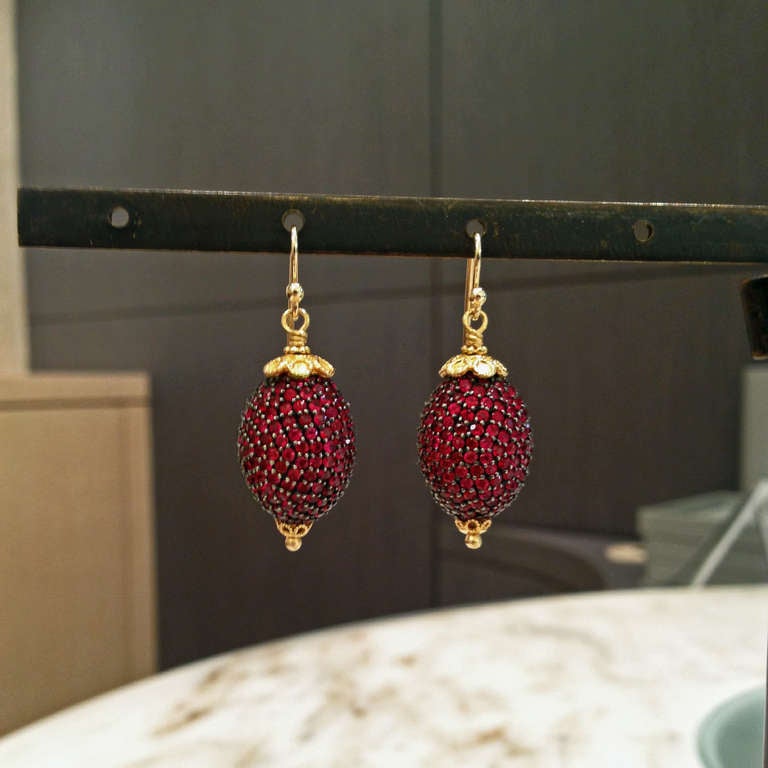 Handcrafted Oval Drop Earrings set in 22k gold and rhodium sterling silver with pave rubies.