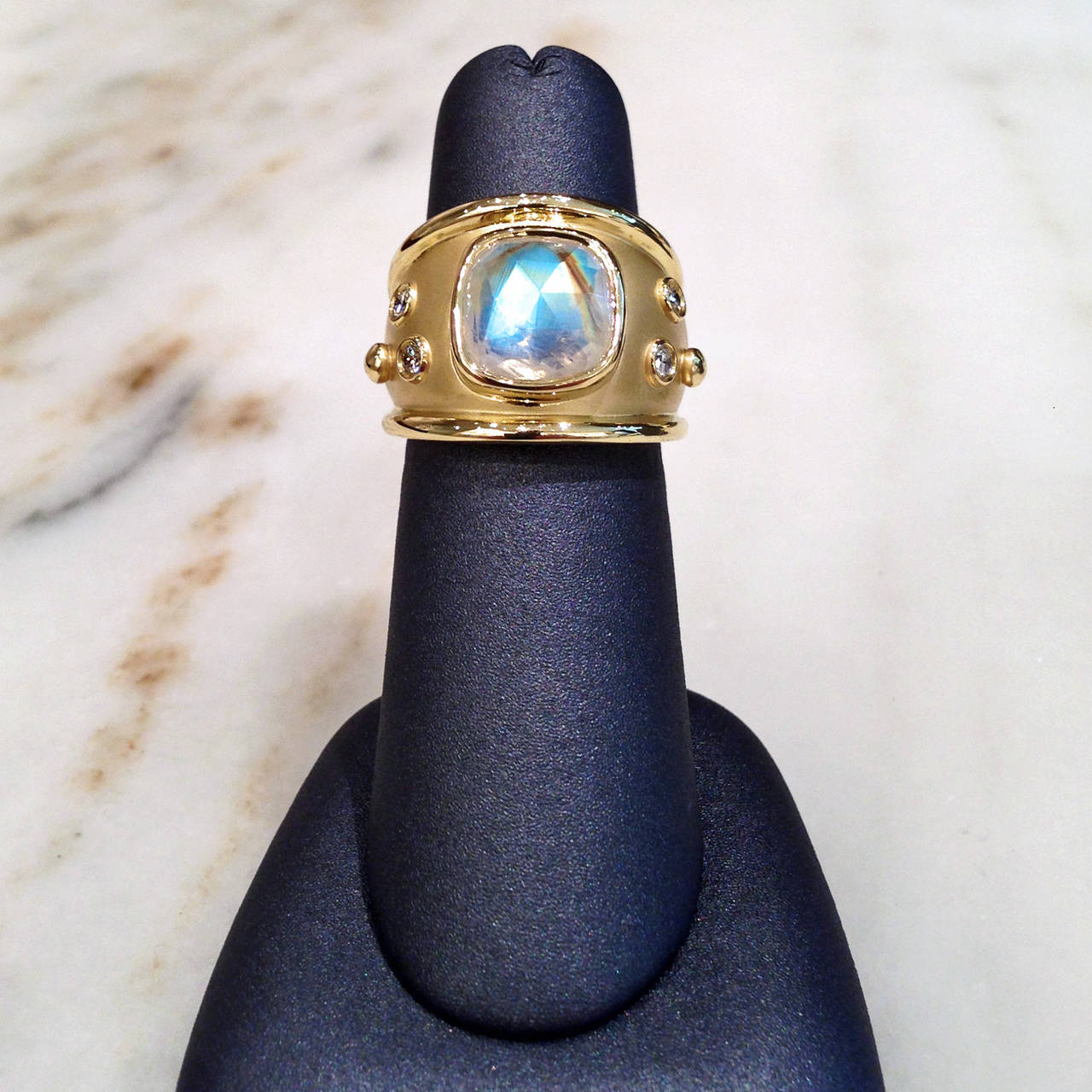 One-of-a-Kind Majestic Ring handcrafted in satin-finished 18.5k yellow gold with a faceted 4.89 carat rainbow moonstone and accented with four white round brilliant-cut diamonds totaling 0.18 carats. 

Size 7.25 (can be sized).
