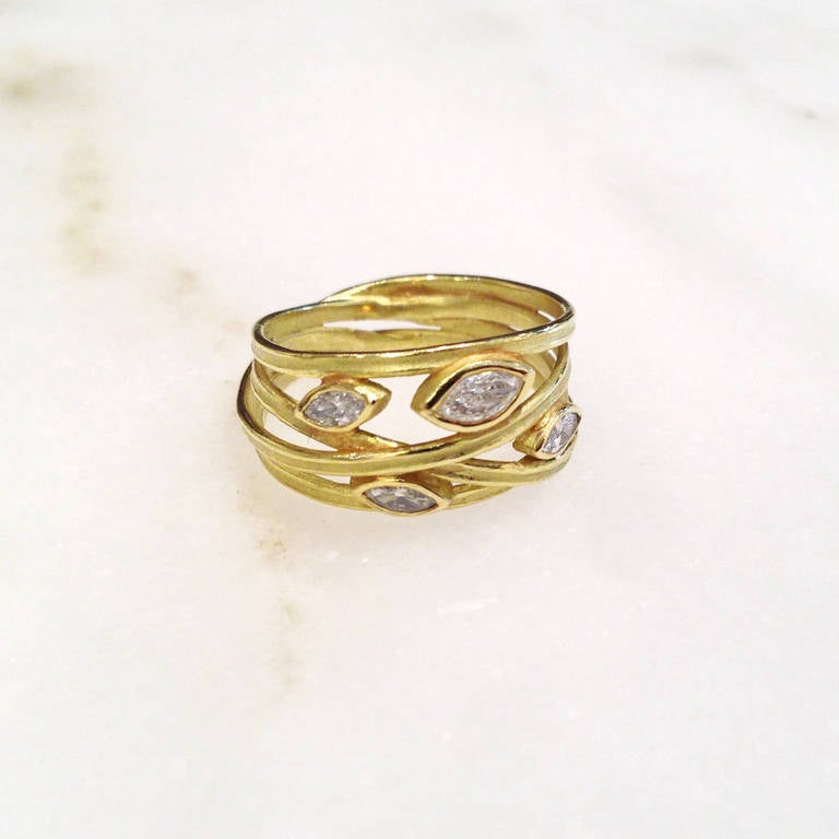 One of a Kind Wrapped Ring handcrafted in 18k yellow gold with 0.41 total carats of white marquis diamonds. Size 6.5 (can be sized).