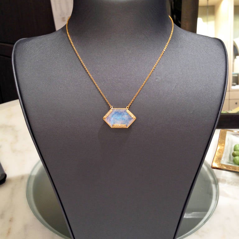 Handcrafted Golden Hexagon Necklace in 18k yellow gold with a rainbow moonstone surrounded by white diamonds (0.32ct).

Necklace Length - 16
