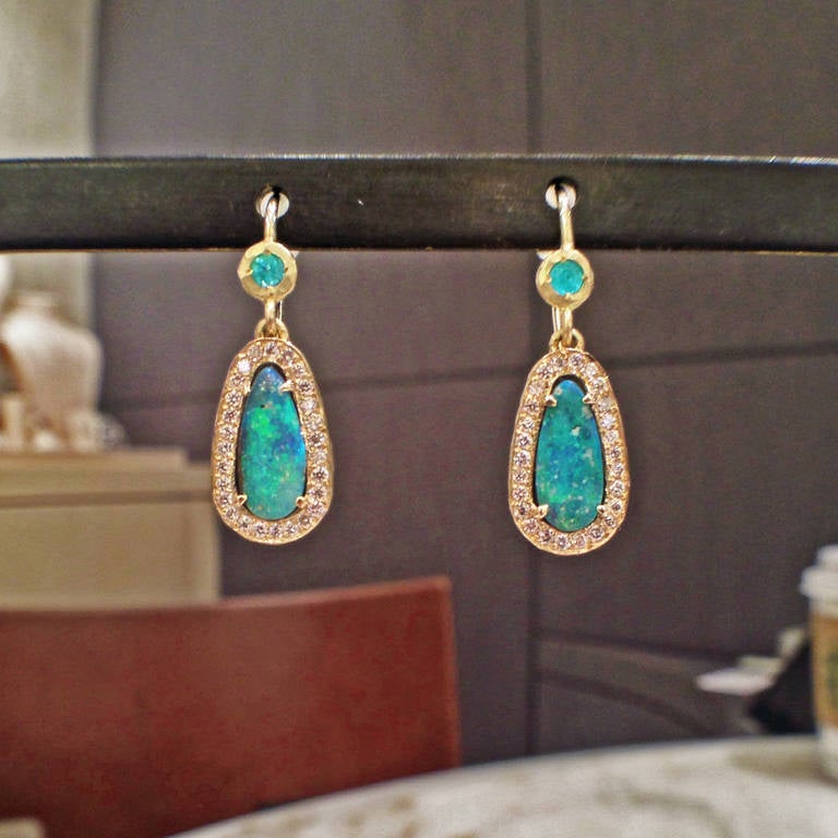 One of a Kind, handcrafted Boulder Opal Drop Earrings in hand-hammered, matte 18k yellow gold with pear-shaped boulder opal (16.30tcw), Paraiba tourmaline (0.09tcw), and a pave' diamond bezel (0.26tcw) on shiny 18k yellow gold wires.