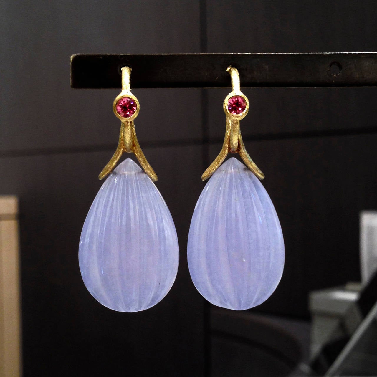 One-of-a-Kind Loop Earrings handcrafted by jewelry artist Joseph Murray in satin-finished 18k yellow gold showcasing a matched pair of hand-carved chalcedony drops and accented by two brilliant-cut pink tourmalines. Stamped and Hallmarked 18k / JM