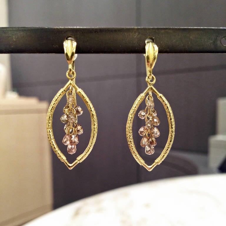 Handmade Open Navette Earrings in 18k yellow gold with 2.00 total carats of floating champagne diamond clusters connected to 18k yellow gold leaf ear wires.