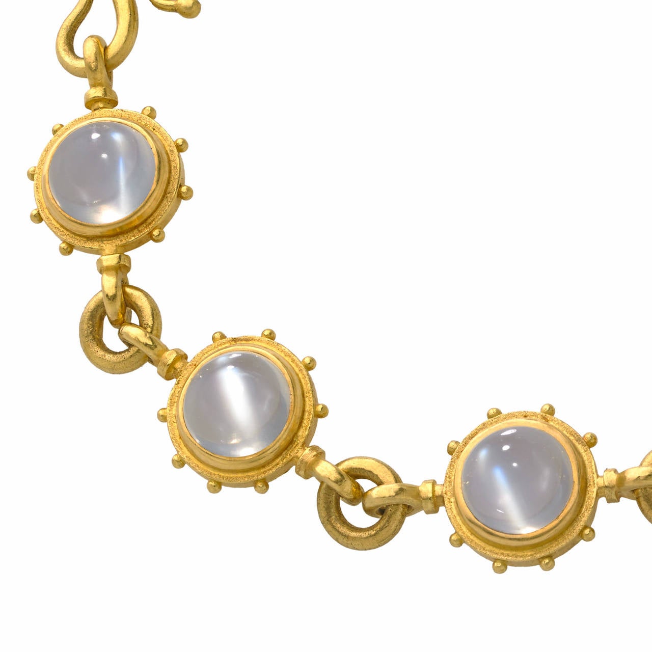 One-of-a-Kind Bracelet handcrafted in 22k yellow gold with eight perfectly-matched cabochon-cut platinum-moonstones exhibiting phenomenal adularescence and a 22k yellow gold 