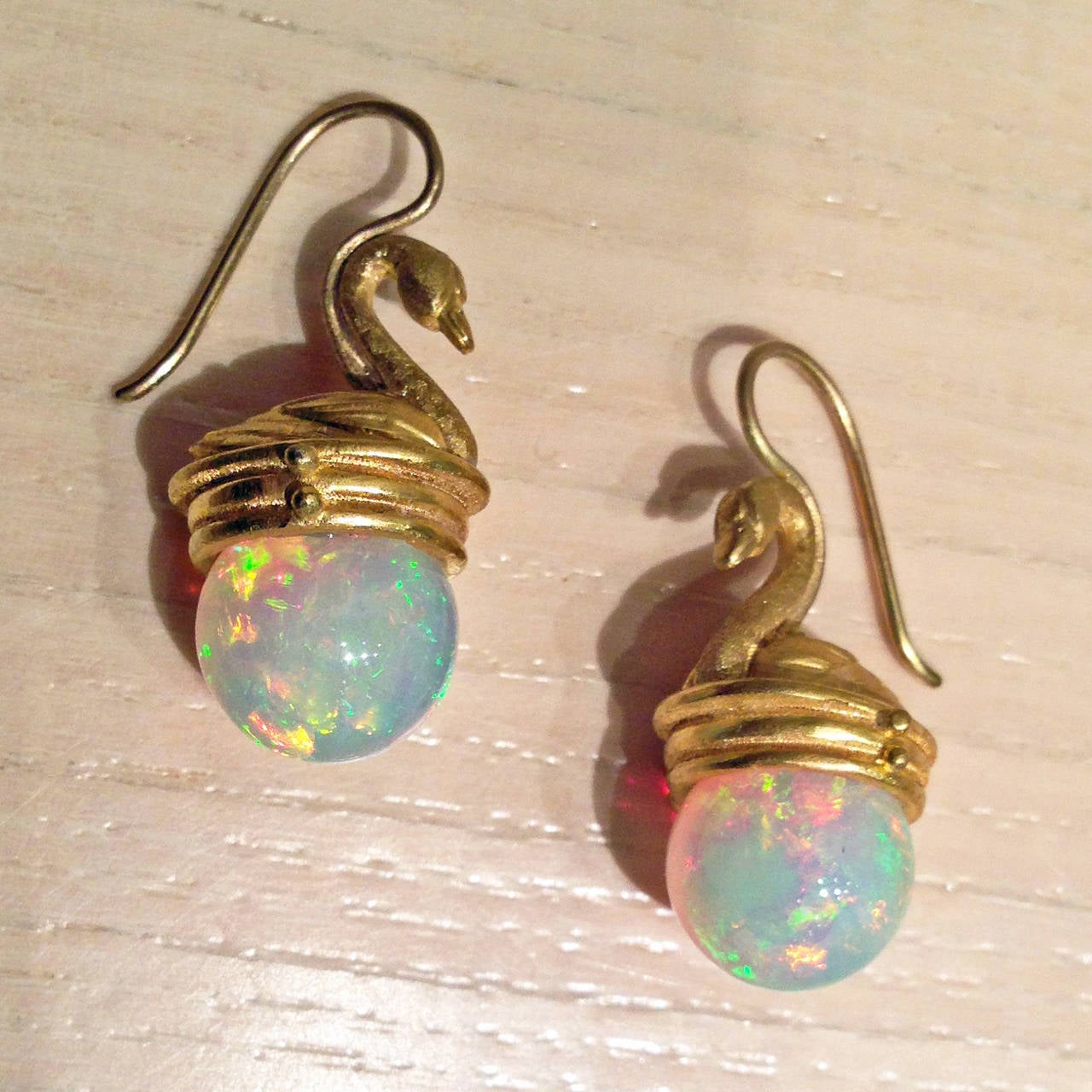 Lilly Fitzgerald Hand-Carved Ethiopian Opal Sphere Golden Swan Earrings In New Condition In Dallas, TX