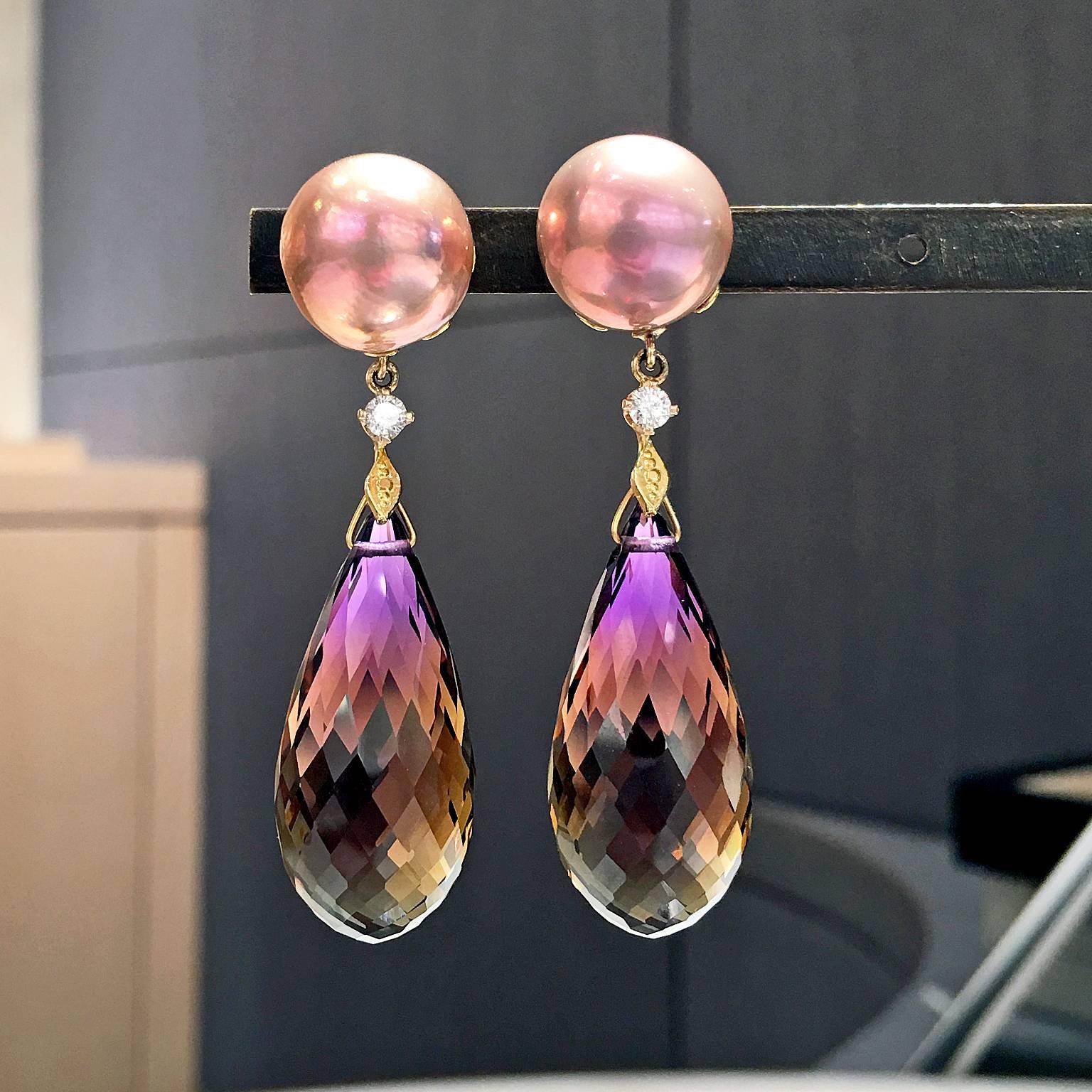 One-of-a-Kind Earrings handcrafted in 18k yellow gold by jewelry artist Russell Trusso featuring a matched pair of faceted ametrine dangling from a round brilliant-cut white diamond accented drop and attached to a matched pair of golden pink