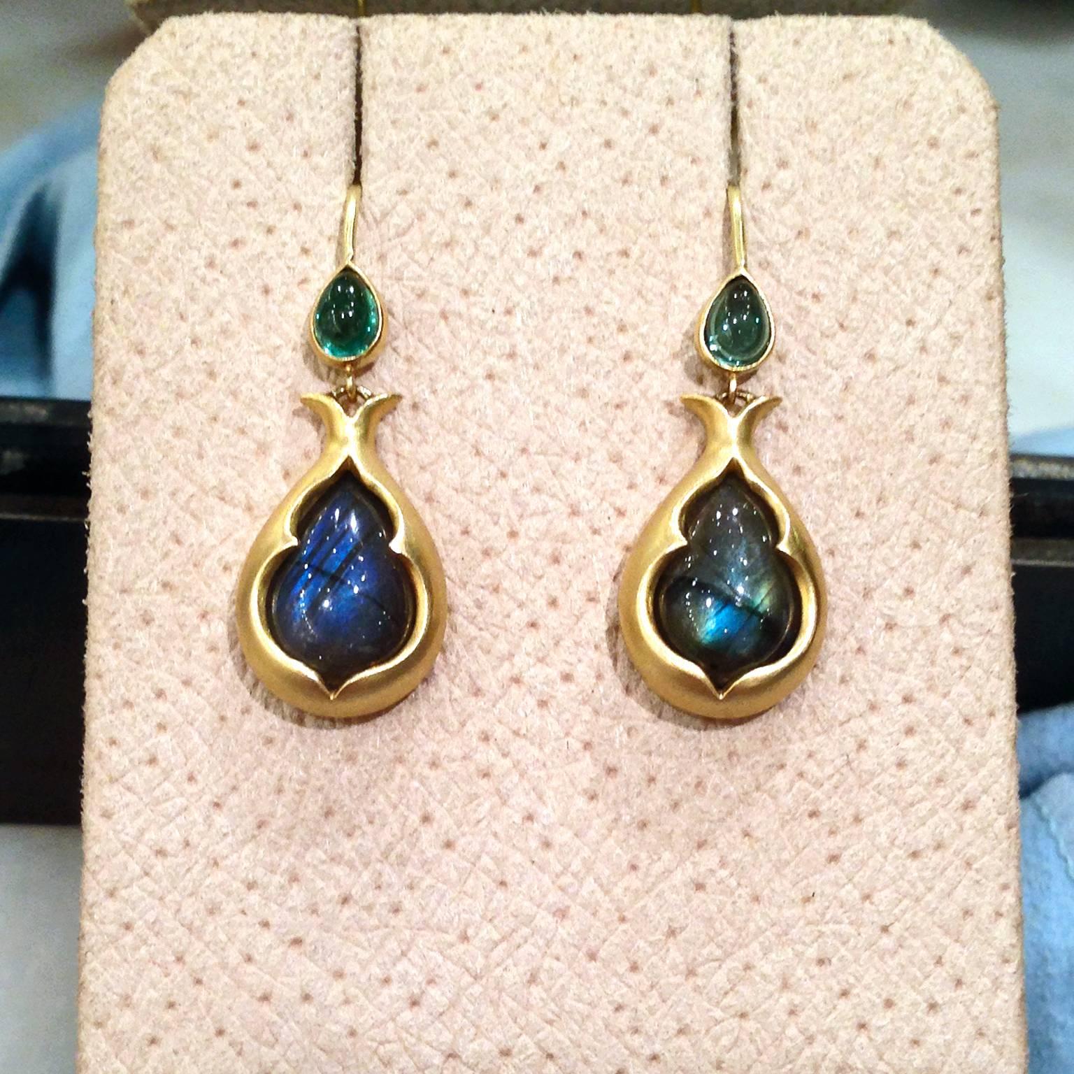Motif Dangle Drop Earrings handcrafted in 2015 by jewelry artist Ana Stein in matte-finished 18k yellow gold with two stunning pear-shaped, cabochon-cut labradorite drops showcasing brilliant blue and green labradorescence, and accented with two