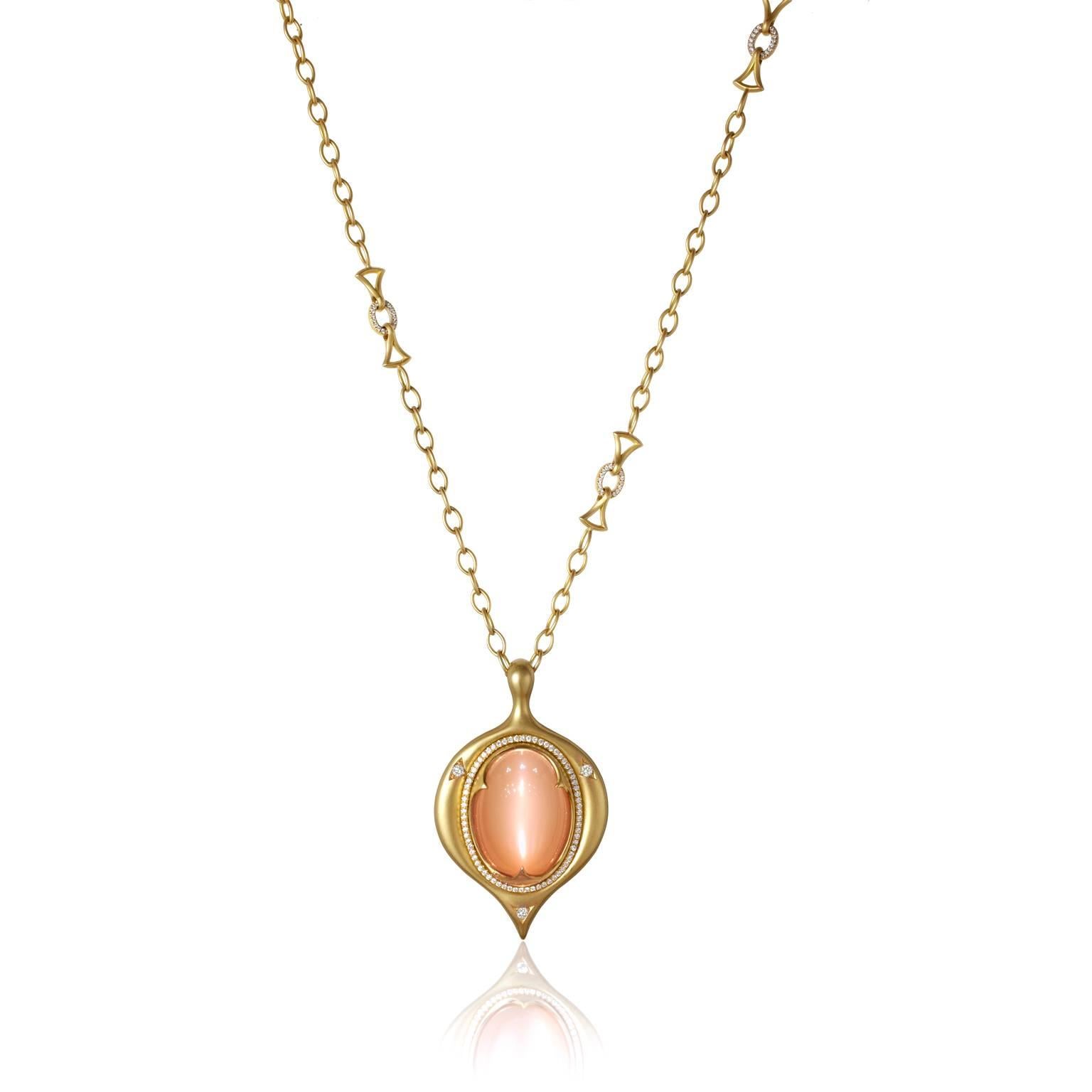 One-of-a-Kind Amulet Necklace handcrafted in matte-finished and satin-finished 18k yellow gold featuring a rare 39.00 carat peach moonstone exhibiting a sensational, glowing cat's-eye that truly can't be captured in pictures. 

The Amulet is adorned