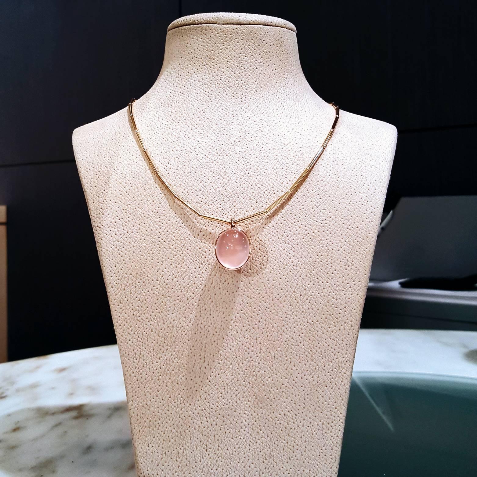 One-of-a-Kind Bowl Pendant handcrafted in 18k gold with a 20.01 carat oval cabochon-cut rose quartz. The Rose quartz, natural and hand-cut in Germany, has truly phenomenal optical qualities as it glows in any light setting. 

Pendant priced with