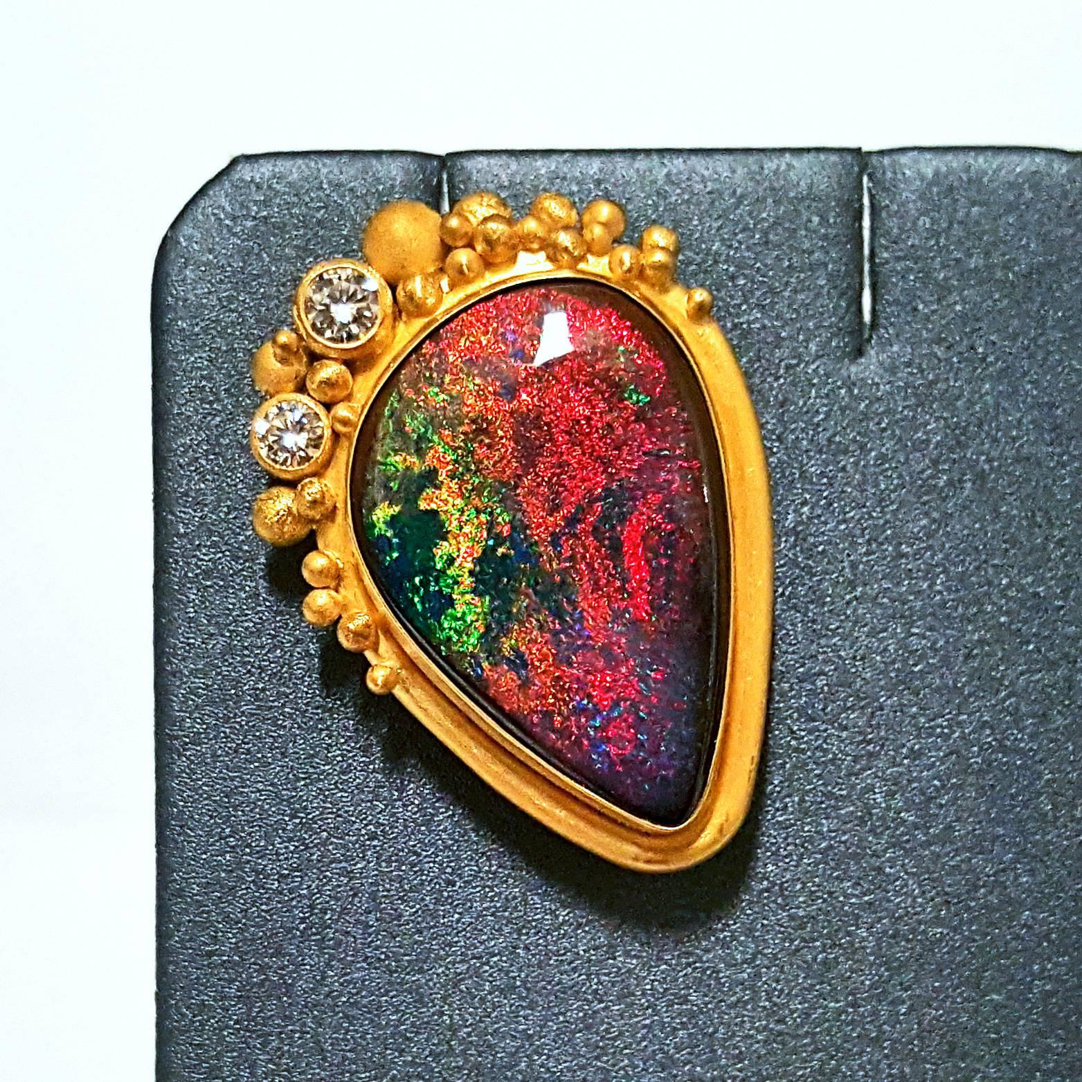 One of a Kind Pin handcrafted in 22k yellow gold by renowned jewelry artist Lilly Fitzgerald. The pin showcases a phenomenal Australian boulder opal of collector's quality, displaying fine rainbow pinfire and a beautiful polish. The opal is