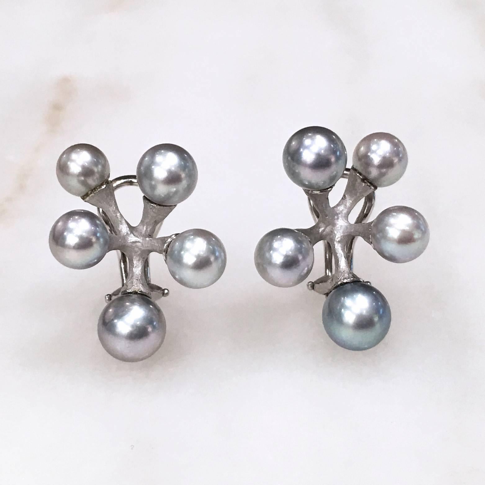 Baby Jacks Earrings handcrafted in matte-finished 18k white gold with lustrous silver Akoya pearls with overtones of blue, violet, and white. Post or clip can be removed upon request. 