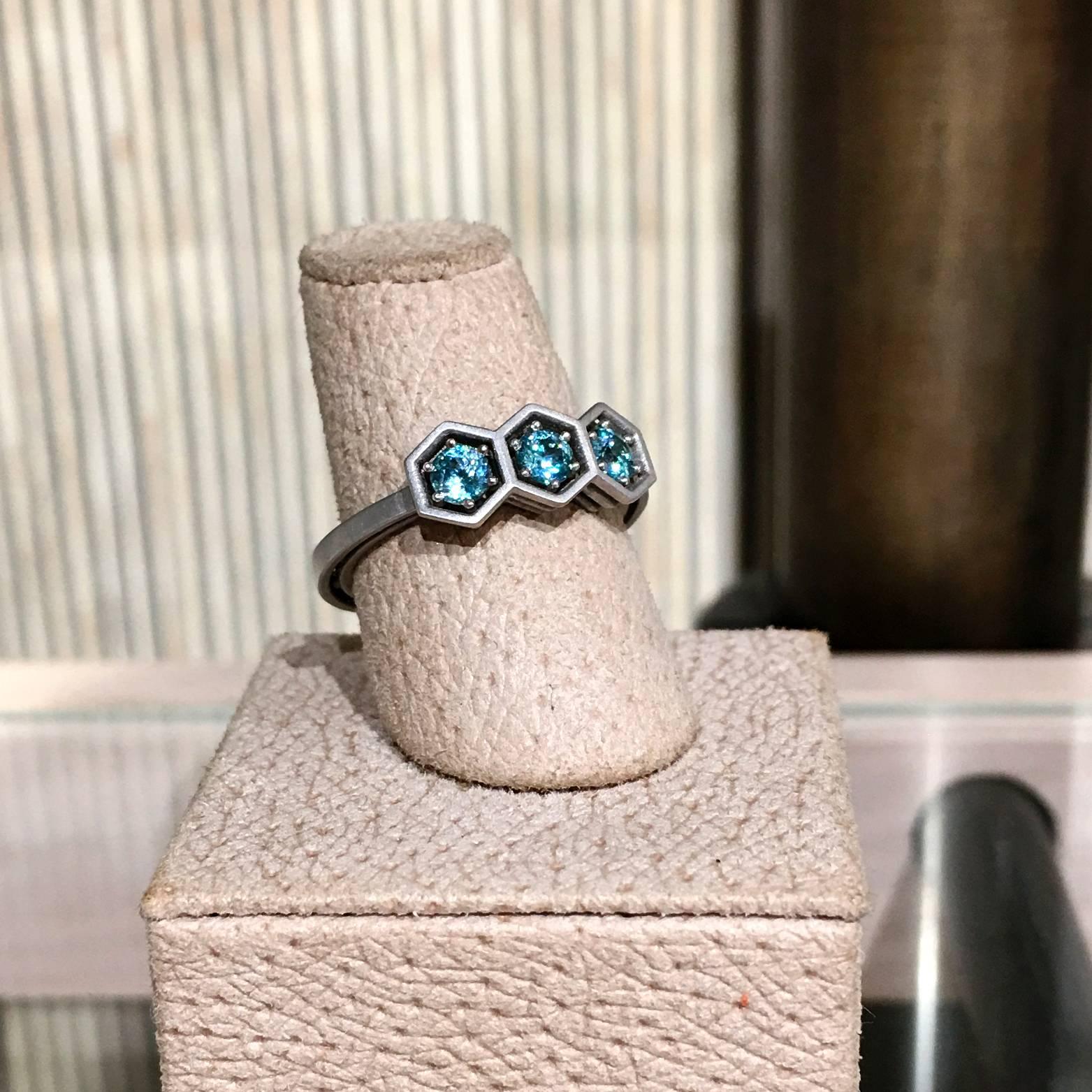 Three-Stone Hex Ring crafted in matte-finished 18k white gold with three brilliant blue zircons totaling 0.63 carats. Size 6.5 (can be sized).