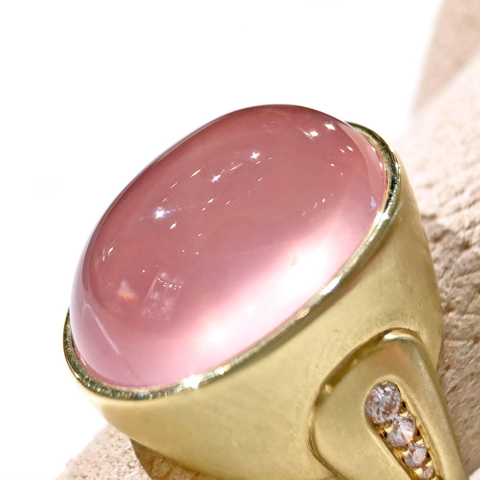One of a Kind Dome Ring handcrafted in matte-finished 18.5k yellow gold featuring an 18.5 carat cabochon-cut rose quartz displaying understated star asterism. The band is accented with 0.24 total carats of F/vs2 round brilliant-cut white diamonds.