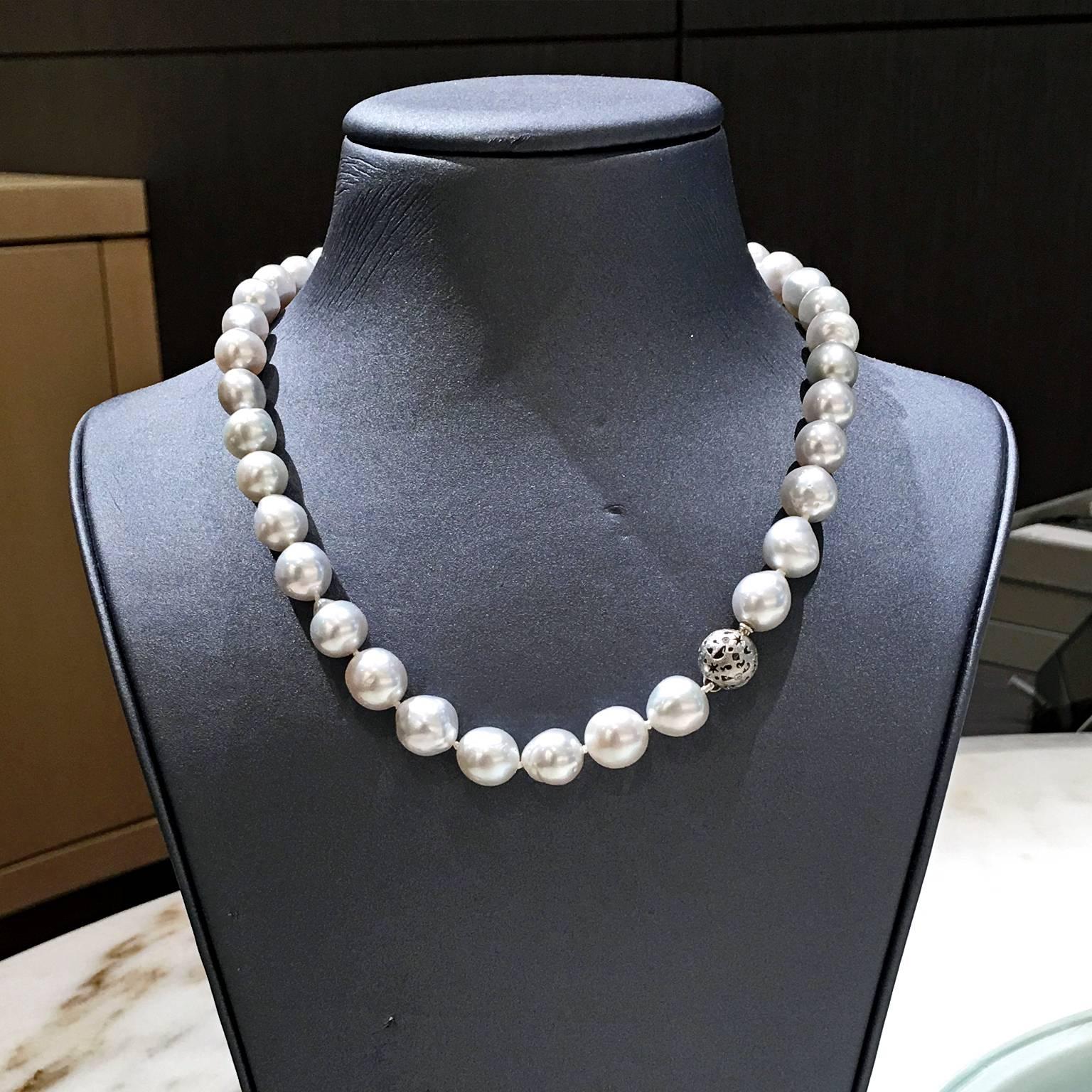 One-of-a-Kind Milkyway Ball Necklace made in 2016 by renowned jewelry artist Barbara Heinrich with a handmade platinum milkyway ball clasp with 0.10 total carats of bezel-set round brilliant-cut white diamonds strung on a strand of stunning silver