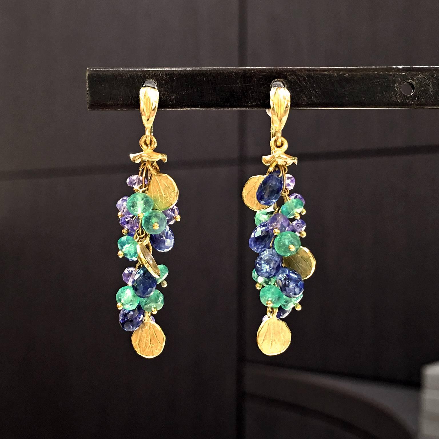 Green Violet and Blue Briolette Drop Earrings handcrafted by renowned jewelry artist Barbara Heinrich in her signature matte-finished 18k yellow gold with 3.04 carats of emerald briolettes, 2.28 carats of tanzanite briolettes, and 7.74 carats of
