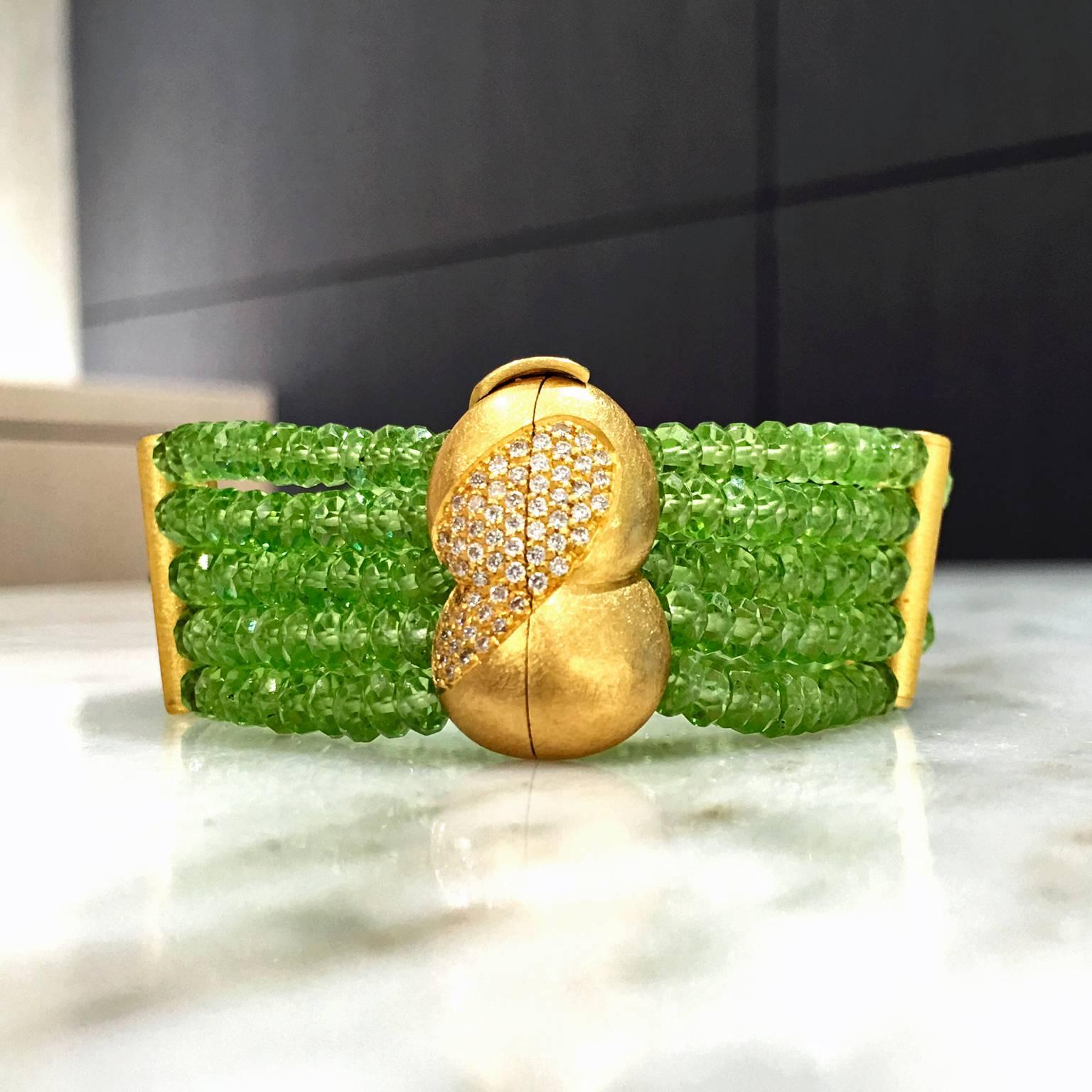 One-of-a-Kind Faceted Peridot Five Strand Bracelet handcrafted by German jewelry artist Eva Steinberg in matte-finished 21k yellow gold with 62 internally flawless, round brilliant-cut white diamonds totaling 0.50 carats, bezel-set in a 21k yellow