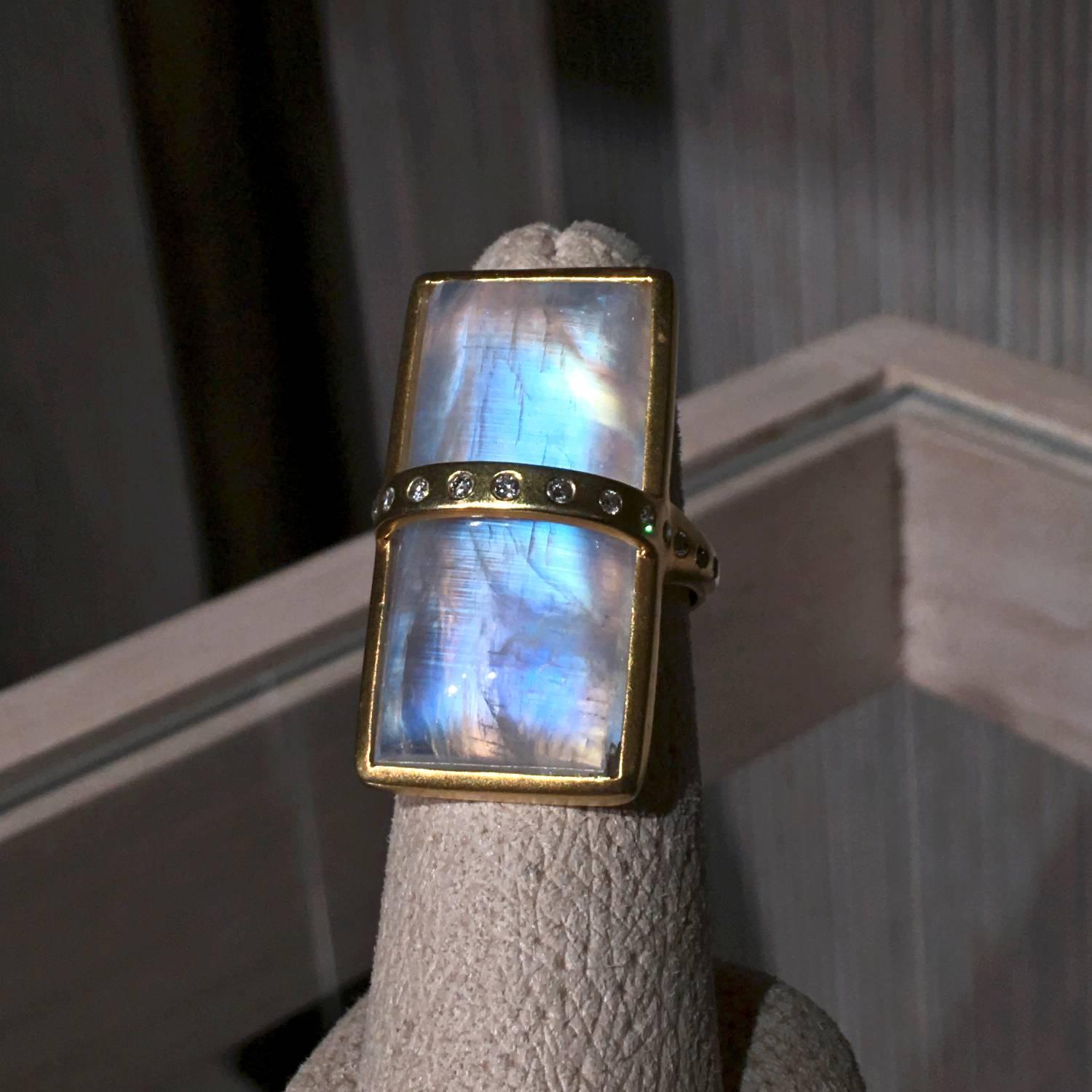 One-of-a-Kind Bar Ring handcrafted by award-winning jewelry designer Lauren Harper in matte-finish 18k yellow gold with a bezel-set rectangular cabochon-cut rainbow moonstone showcasing primarily blue and violet hues with flashes of orange, red, and