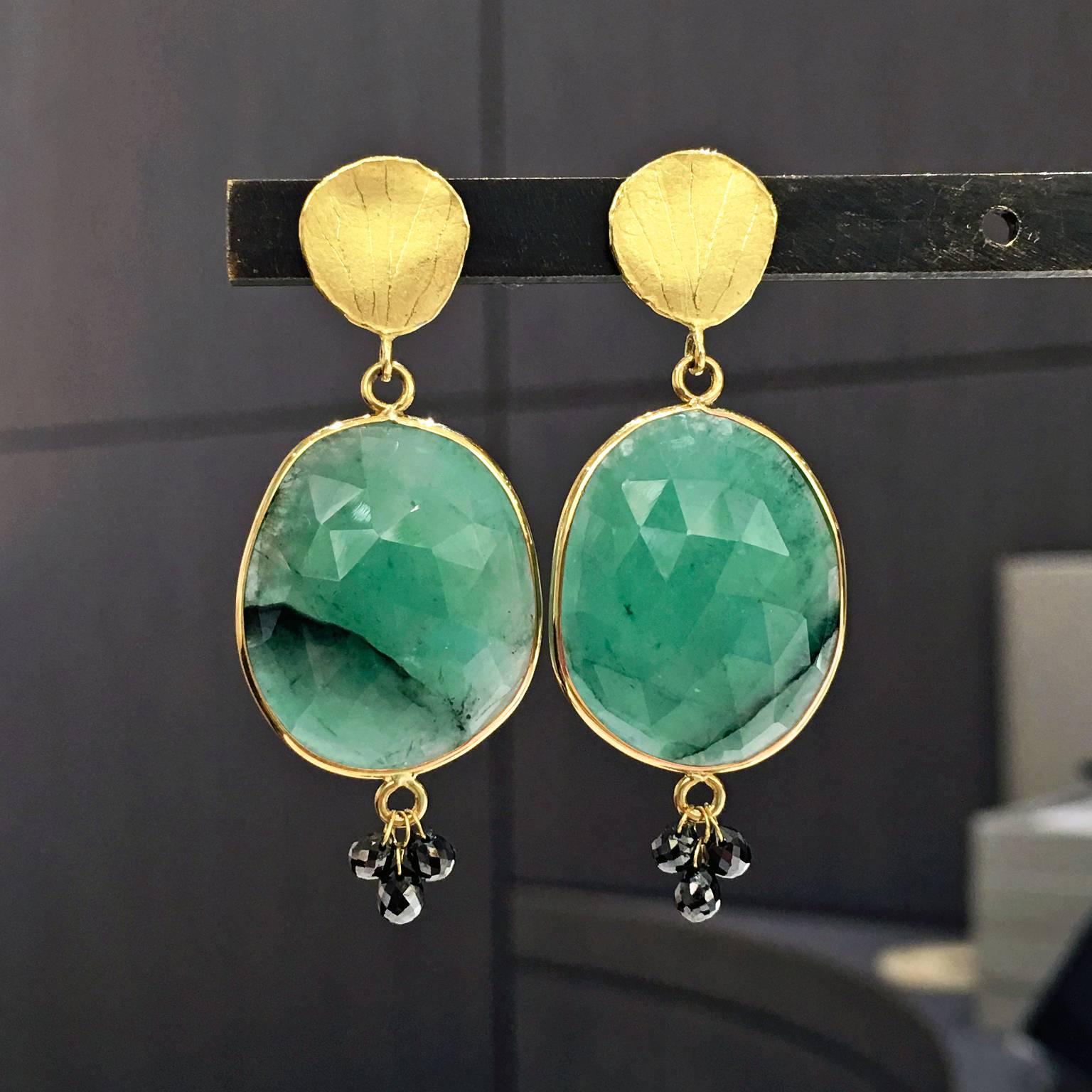 One of a Kind Petal Dangle Earrings handcrafted by award-winning jewelry designer Barbara Heinrich in matte-finished 18k yellow gold with gorgeous faceted emerald slices accented with six black diamond briolettes totaling 1.31 carats. 

18k posts