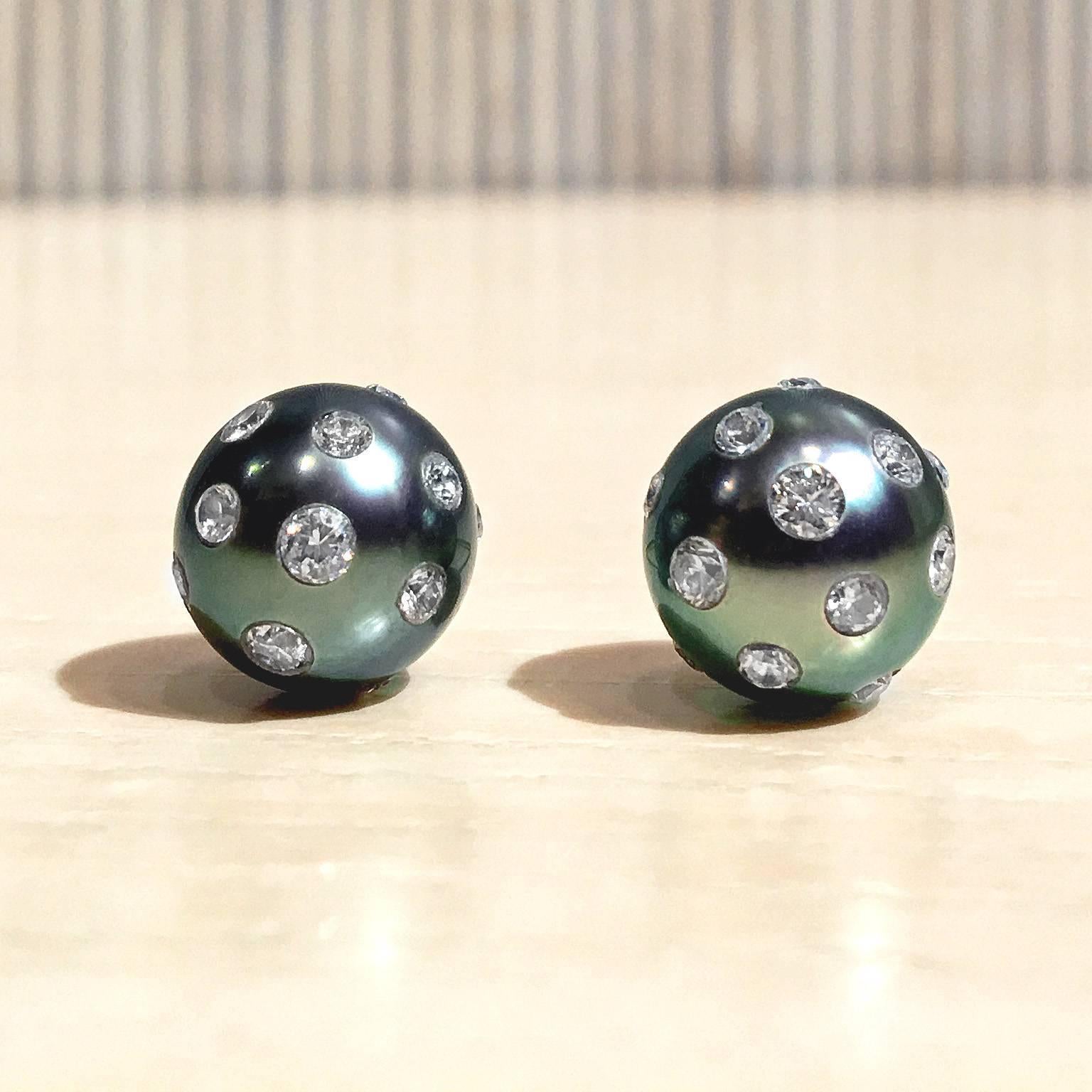 One of a Kind 10mm Lustrous Tahitian Pearl Earrings handcrafted by Russell Trusso with 0.77 total carats of embedded white round brilliant-cut diamonds and 18k yellow gold posts and backs. Stamped 750