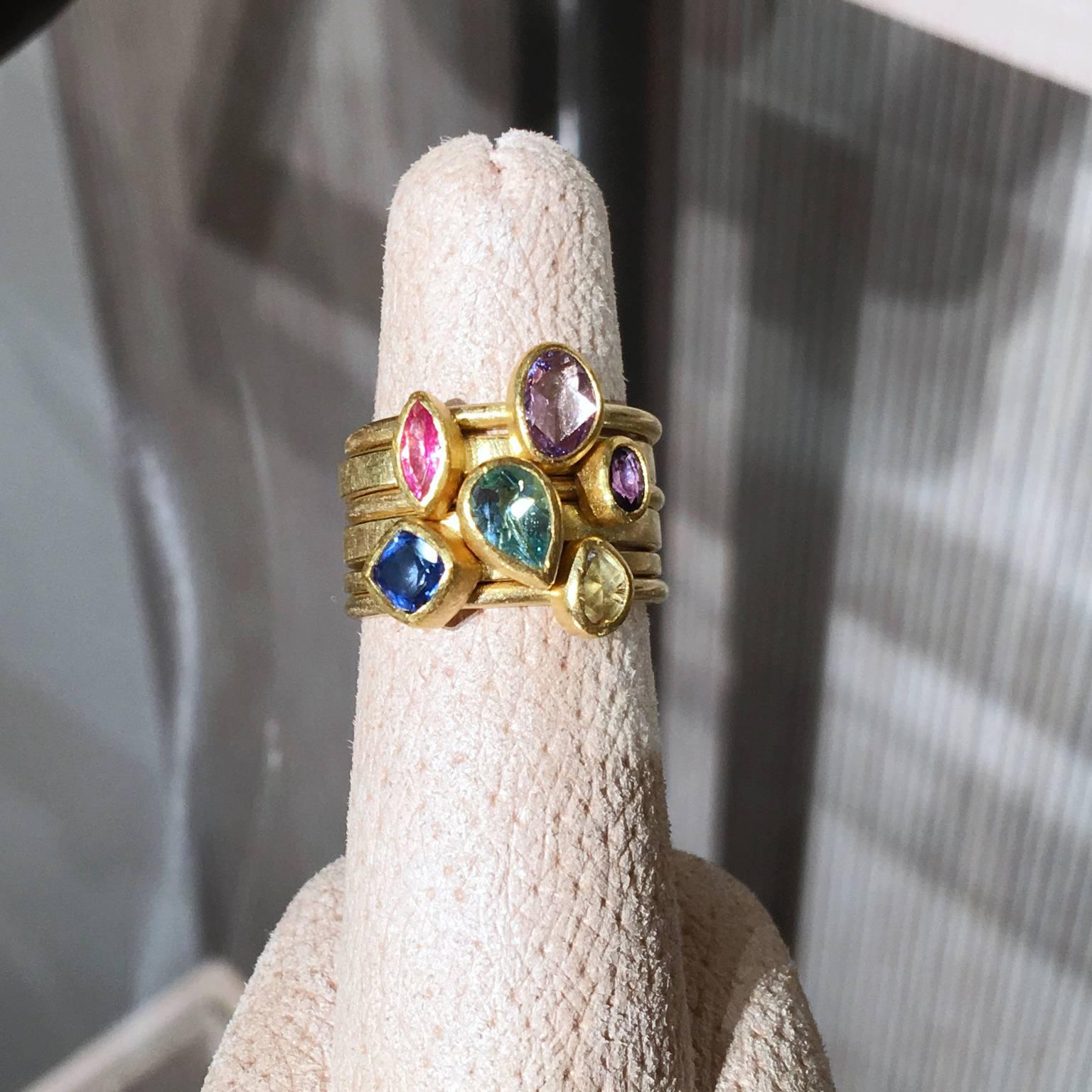 One-of-a-Kind Stacking Ring Set (also available individually) handcrafted by jewelry artist Petra Class with assorted width 22k yellow gold and 18k yellow gold bands. Showcasing bezel-set gemstones from top to bottom:

Pale Pink Abstract Oval