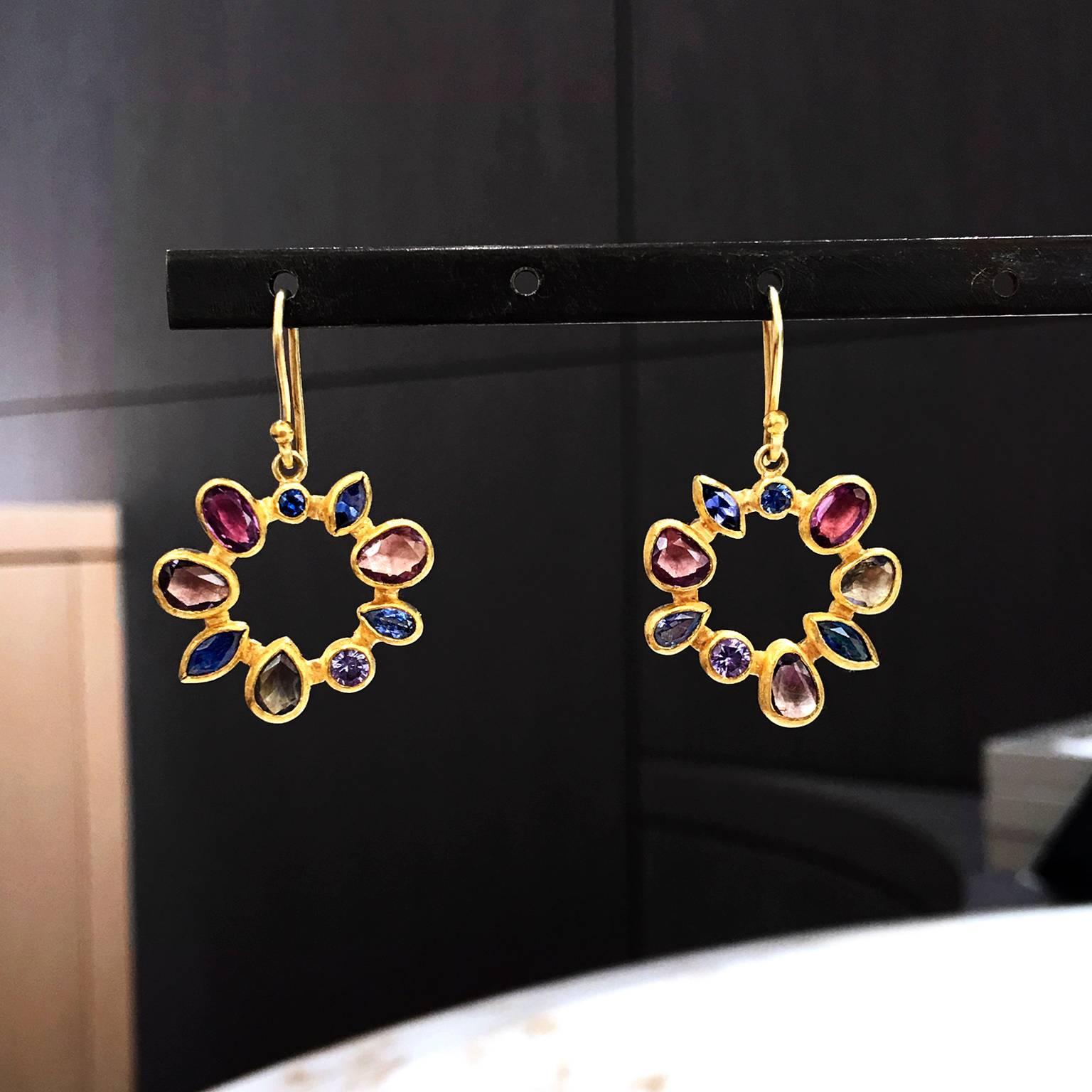 One of a Kind Radial Drop Earrings handcrafted by renowned jewelry designer Petra Class with beautifully harmonized shimmering blue, violet, red and purple faceted Montana sapphires bezel-set in Petra's signature 22k yellow gold dangling on 18k